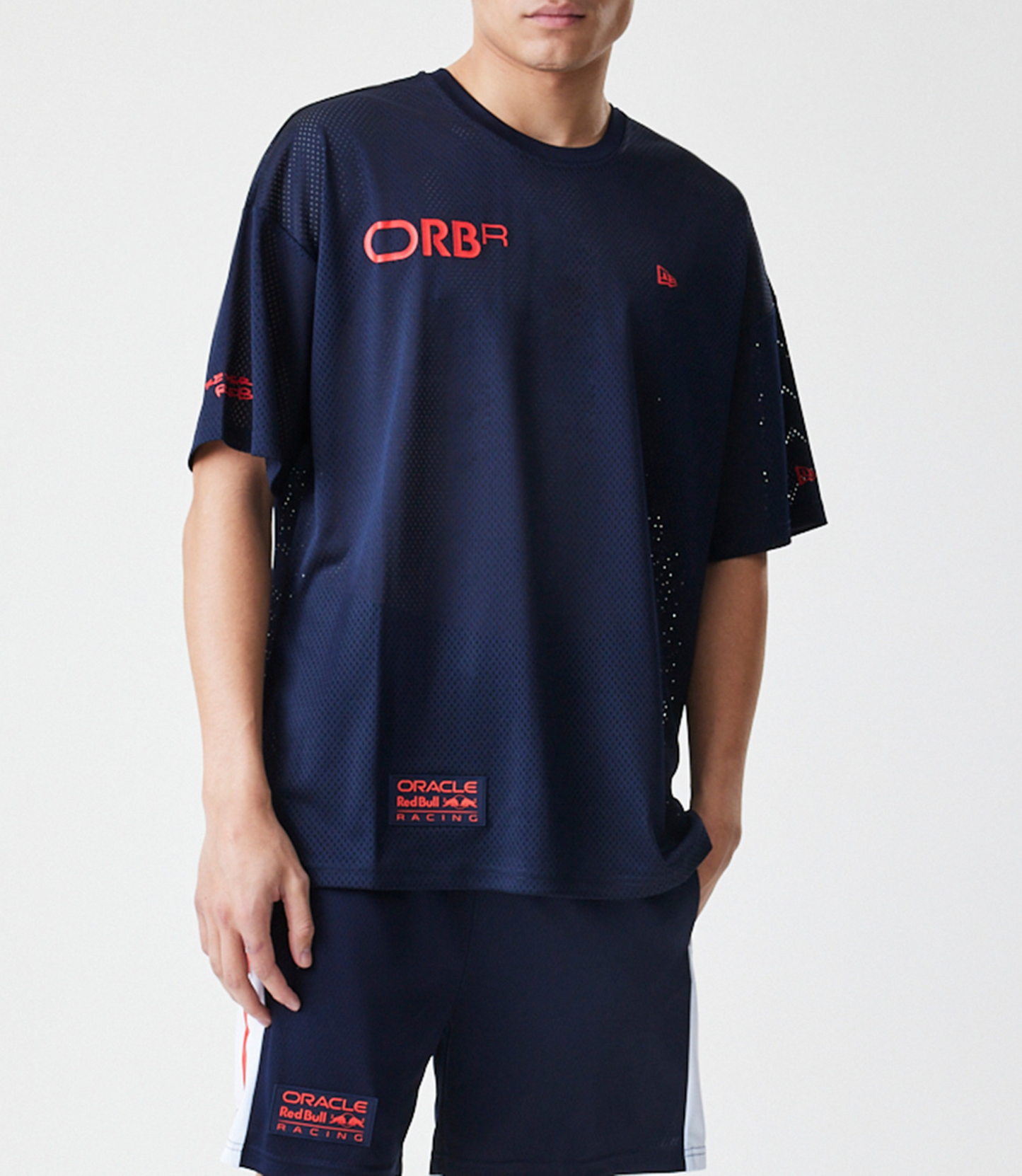 Dark blue mesh T shirt with a bold red Oracle Red Bull Racing logo on the chest