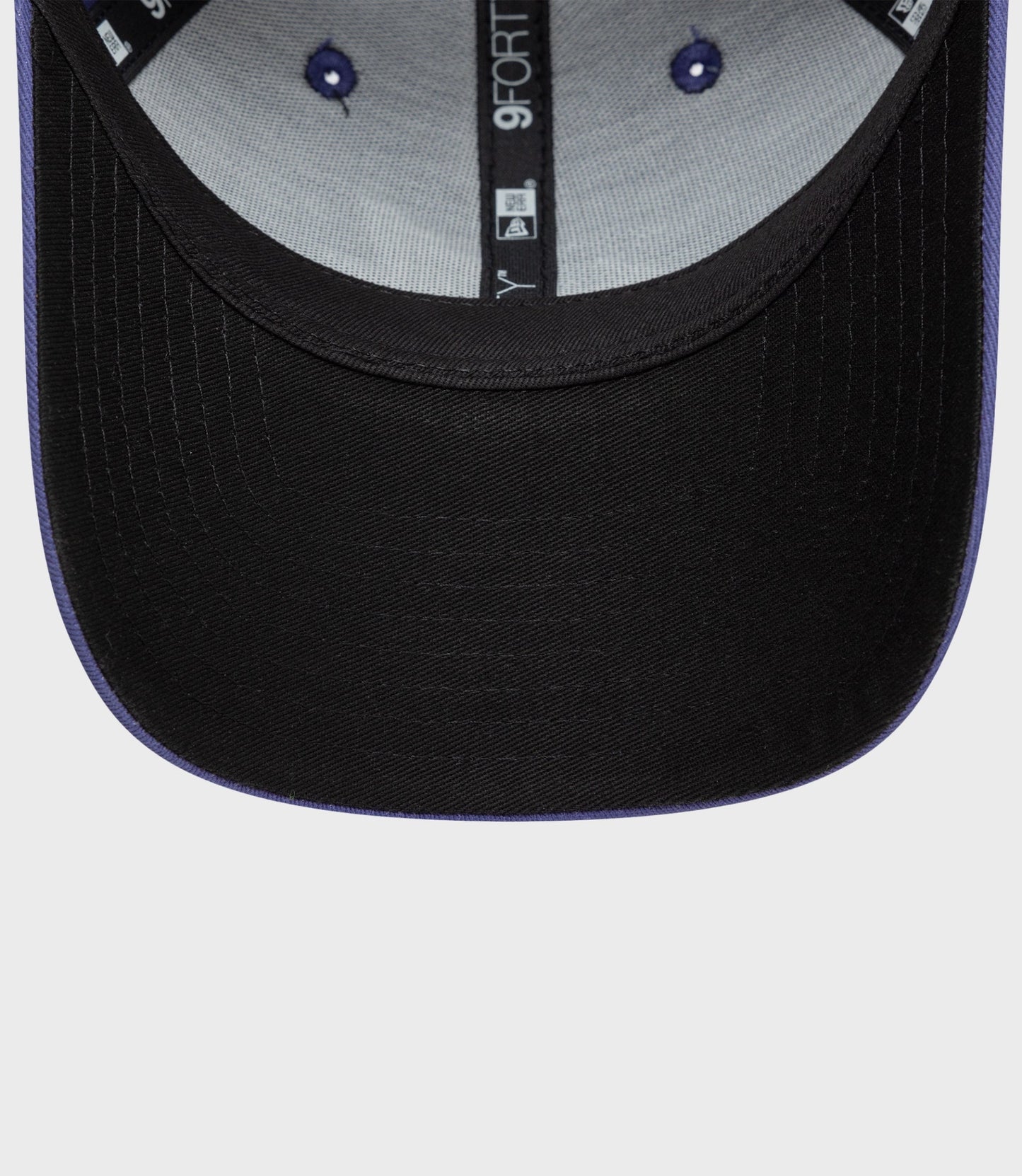 Inside view of the cap showing grey crown lining and 9Forty branding along the center seam