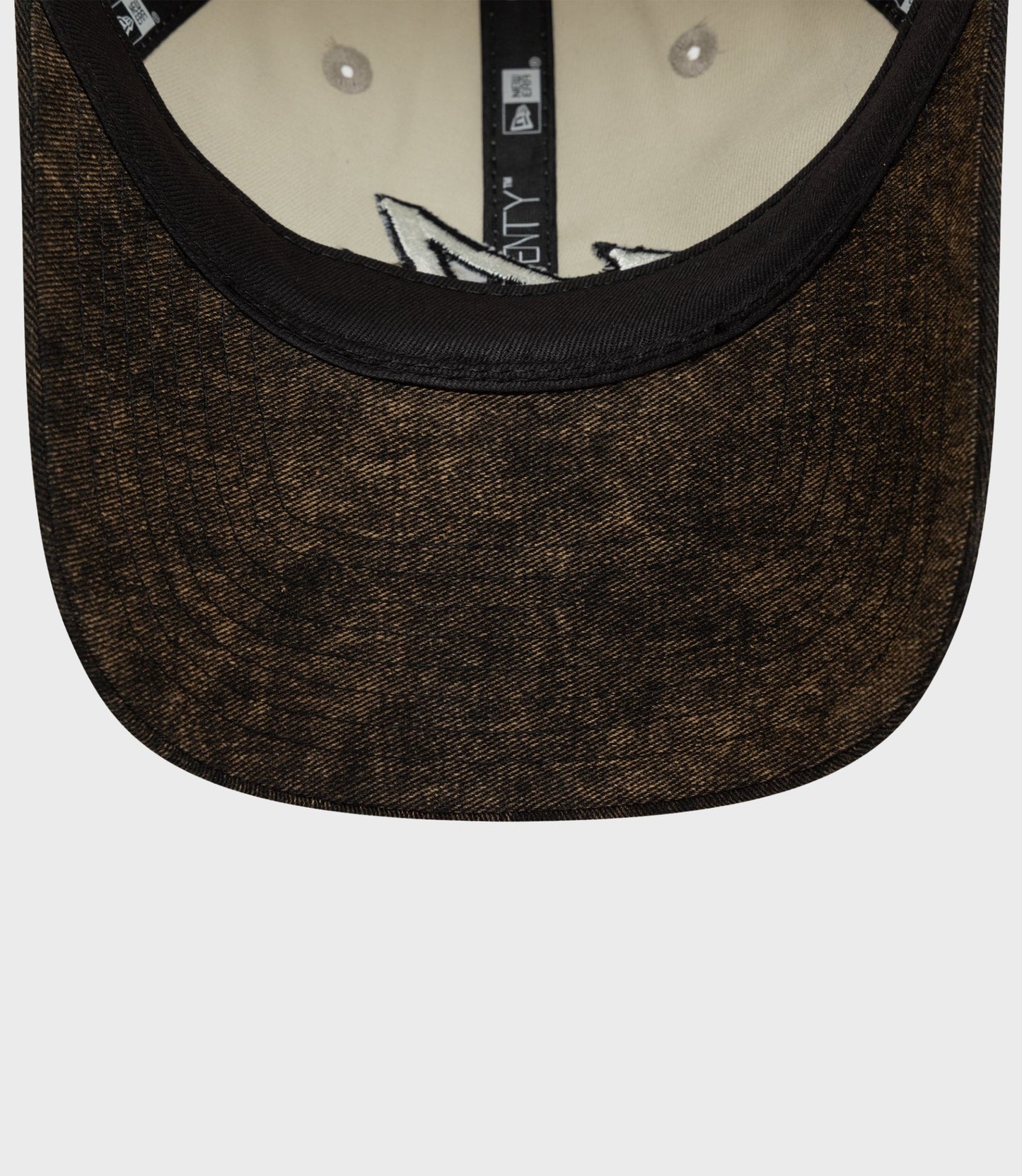 Back view of off white New Era Alpine Acid Wash 9Twenty cap with adjustable strap and brown brim