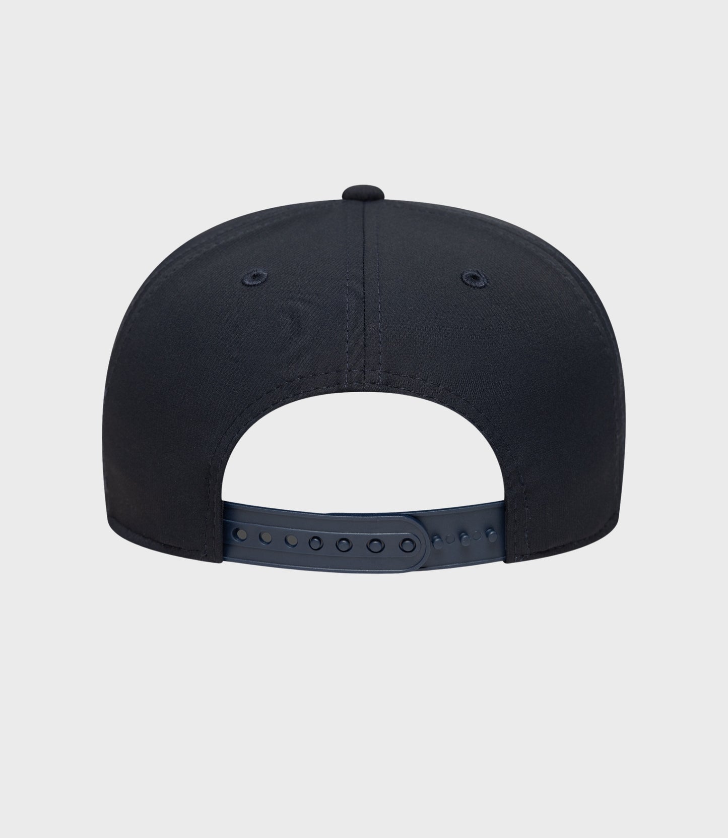 Back view of navy New Era Rep Team 9Seventy stretch snap cap with plastic snap closure