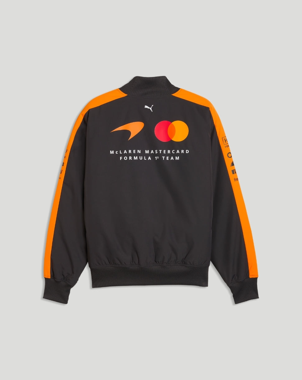Back view of McLaren Mastercard Formula 1 Team bomber jacket with orange shoulder panels and team branding.