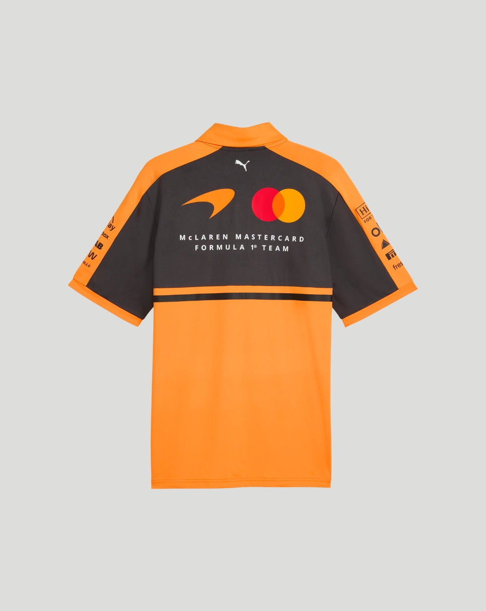 Back view of the McLaren Team Polo in papaya orange, featuring a dark navy upper back and sponsor logos