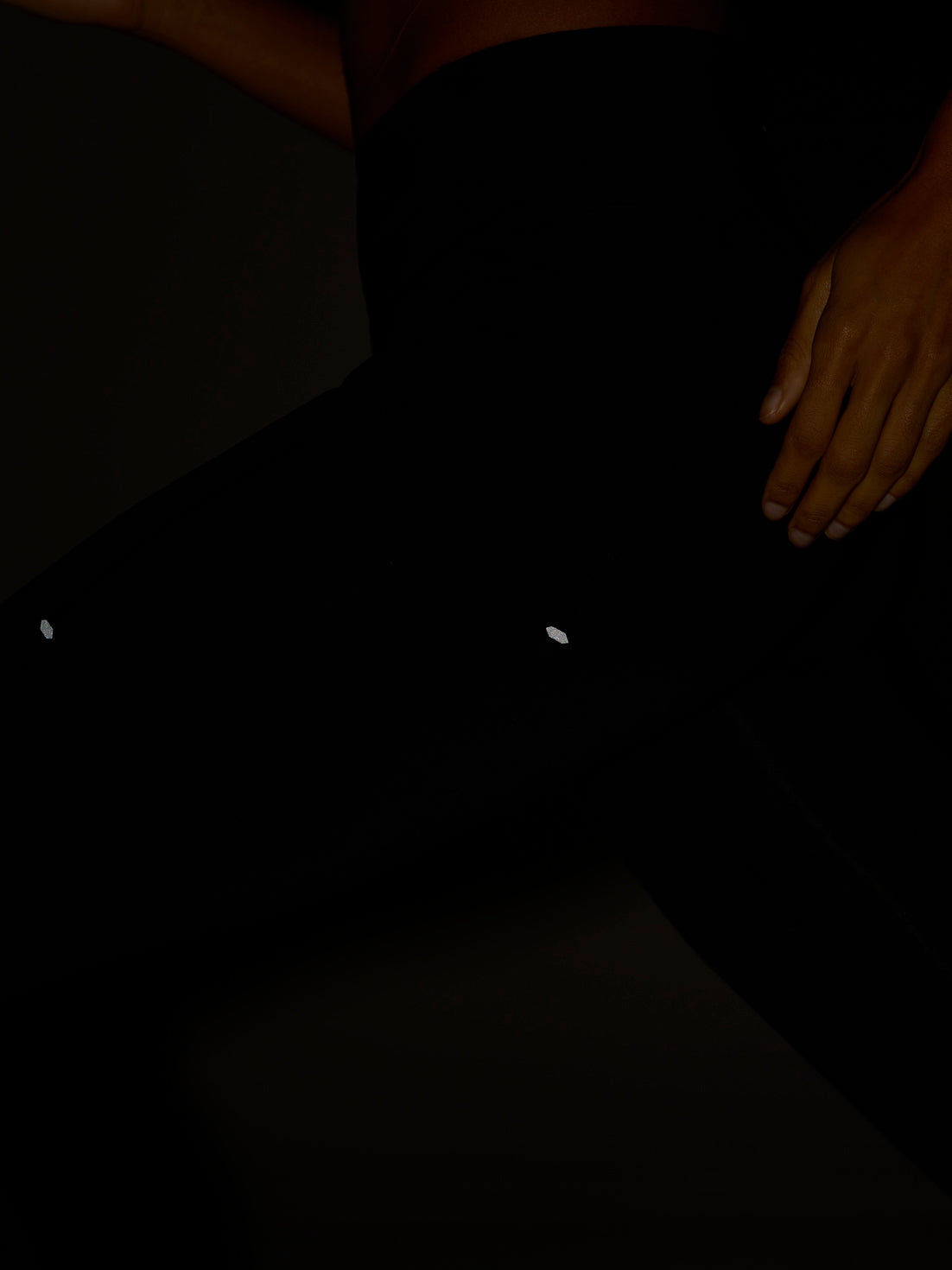 Zone Training Leggings black full length on a model with a mid rise and subtle reflective accents at the thighs