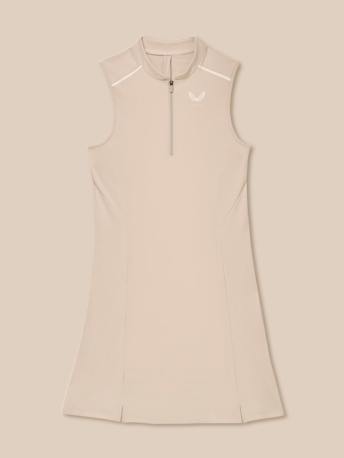 Pinnacle Dress in Stone front view on a model; sleeveless beige performance dress with a quarter zip and sleek paneling.