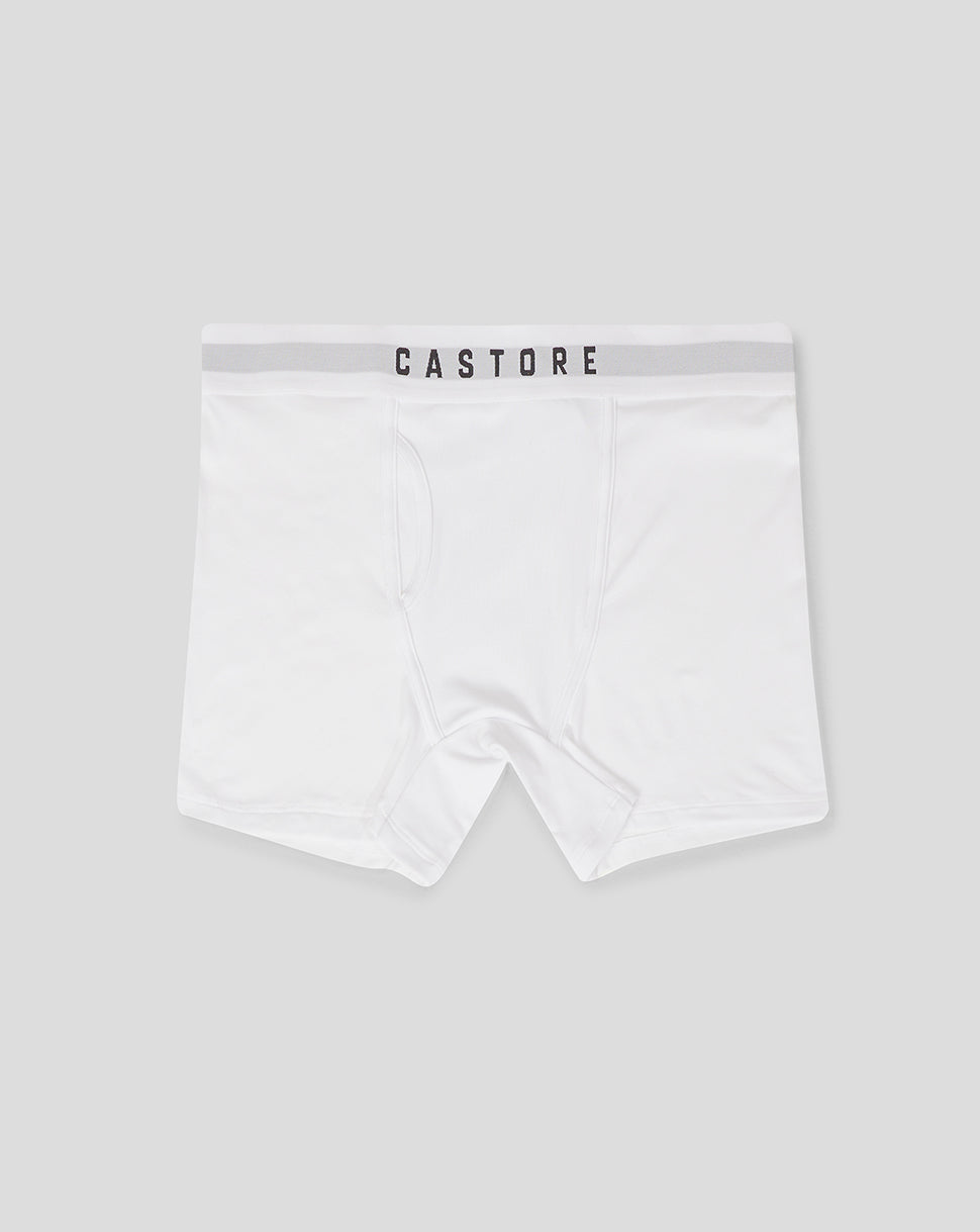 White boxer shorts laid flat with Castore waistband and front panel seam