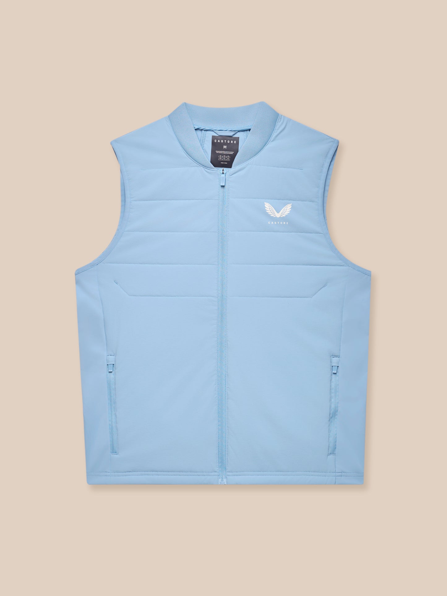 Close-up of sky blue Apex Training Gilet showing zipper and Castore logo on chest