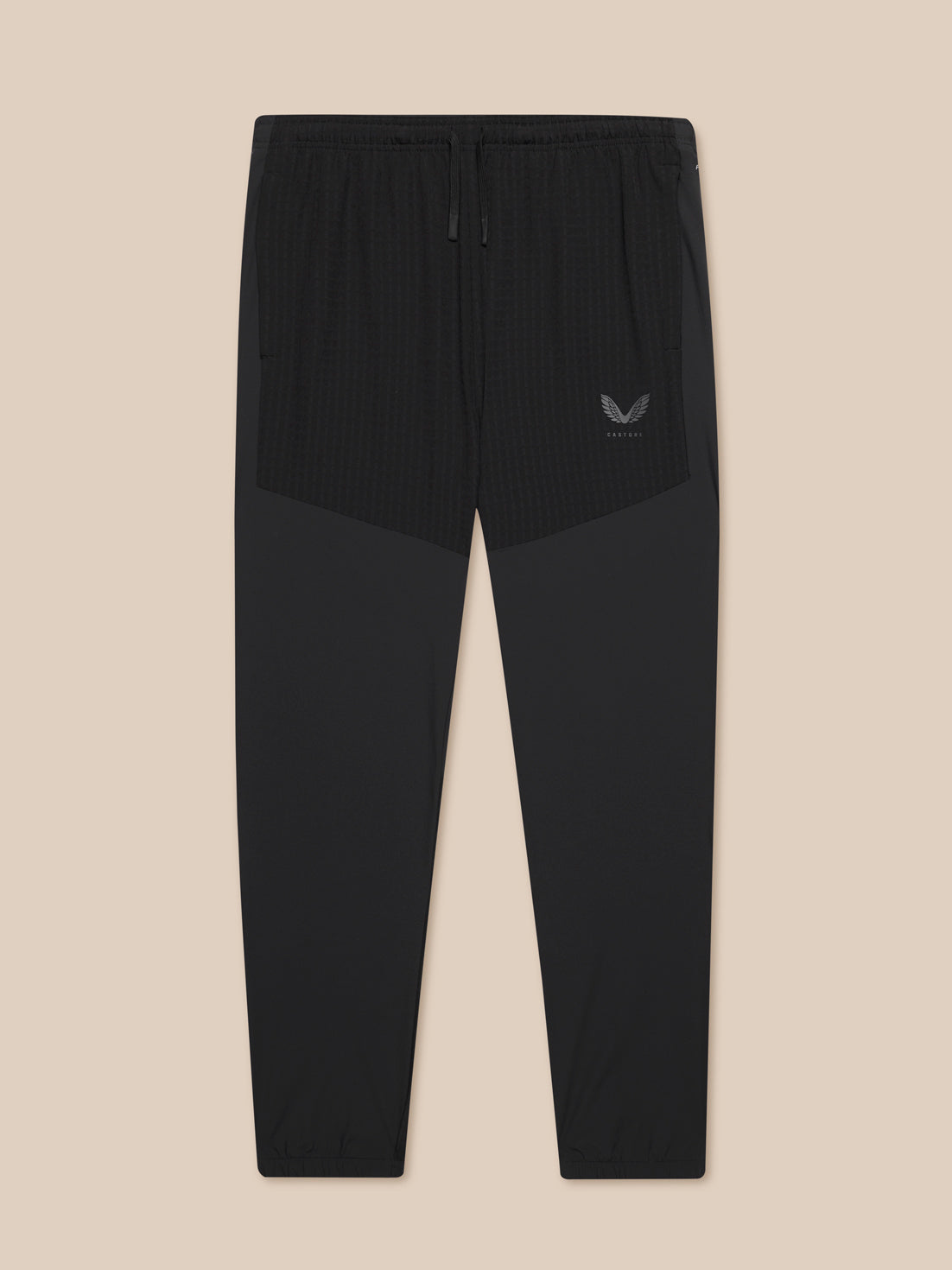 Black Winterised Flex Joggers with tonal panels, elastic cuffs and waistband, zipped side pockets, Castore logo on left thigh and ProTek branding at left rear