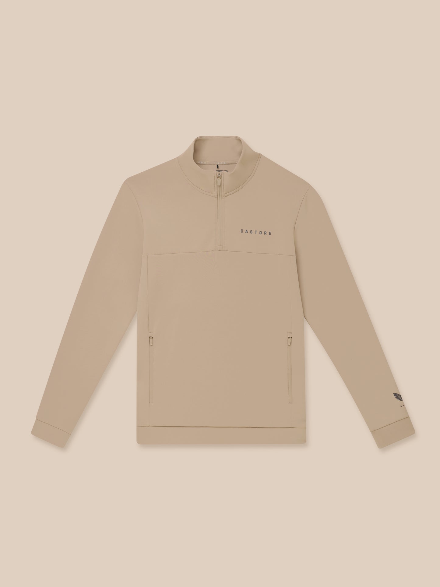 Close up of beige Flex Lifestyle 1/4 Zip showing chest Castore wordmark and quarter zip detail