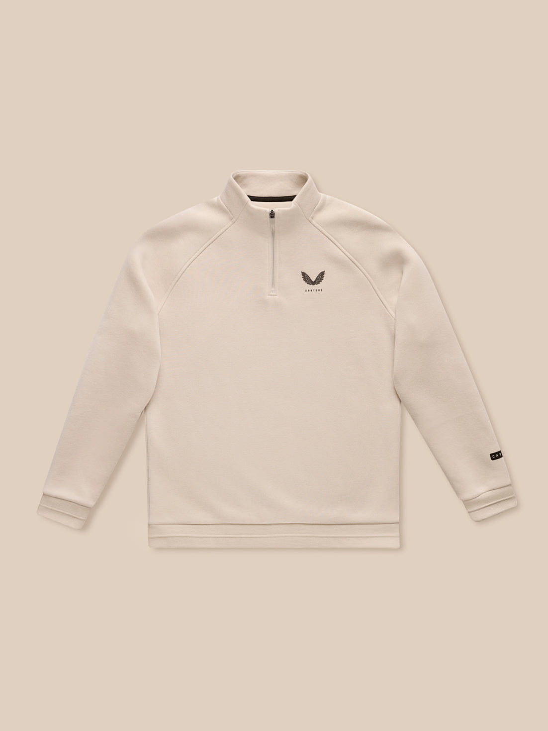 Adapt Fleece Quarter Zip in stone with a stand collar and small chest logo on beige fabric