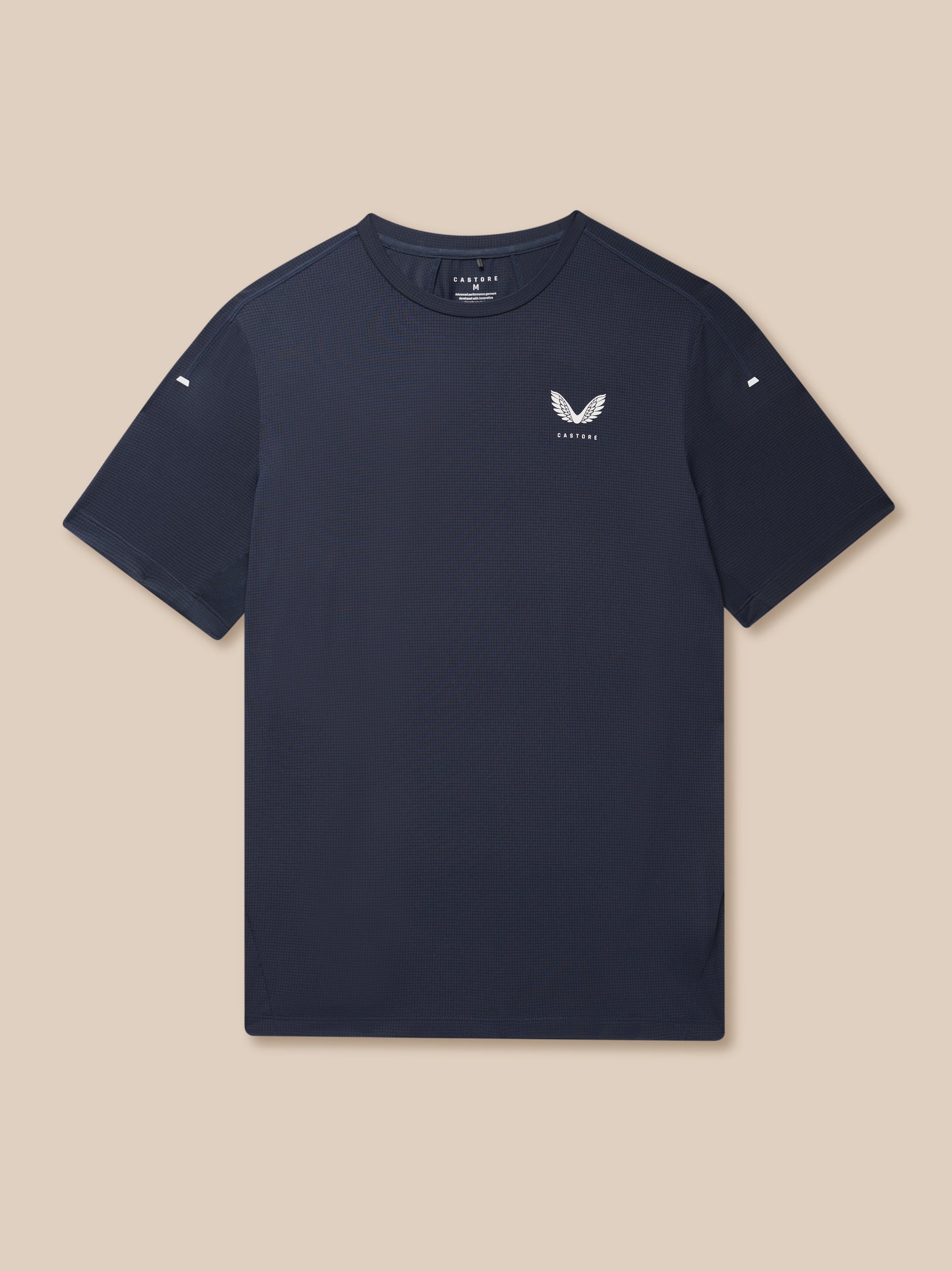 Close-up of navy Apex Training T-Shirt showing textured fabric chest logo and sleeve patch