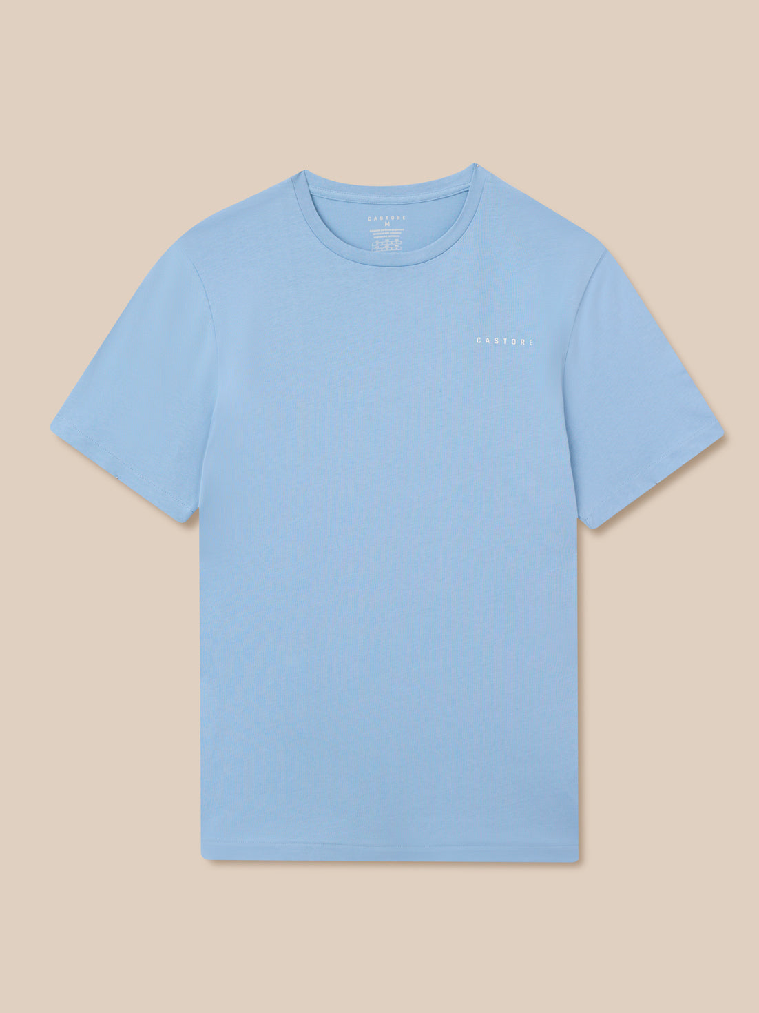 Sky blue graphic training t shirt laid flat with a small white Castore logo on the chest