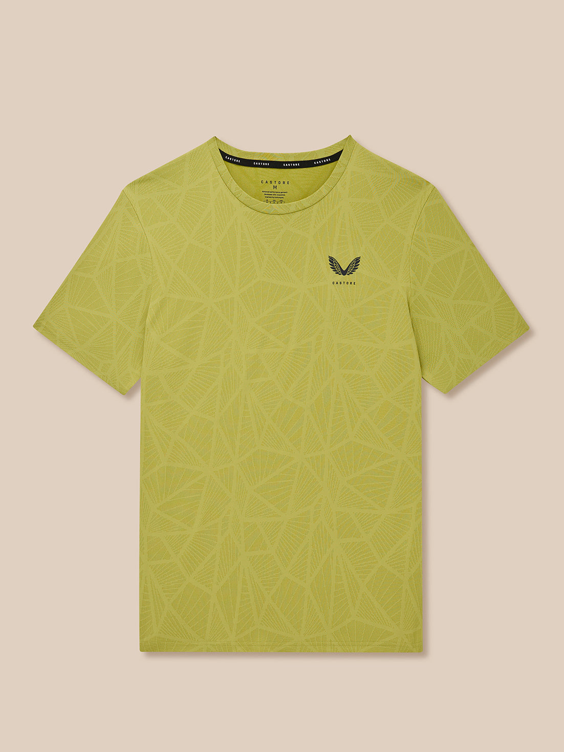Flat lay of Flow Training Engineered Knit T Shirt in mustard with geometric knit print and Castore logo.