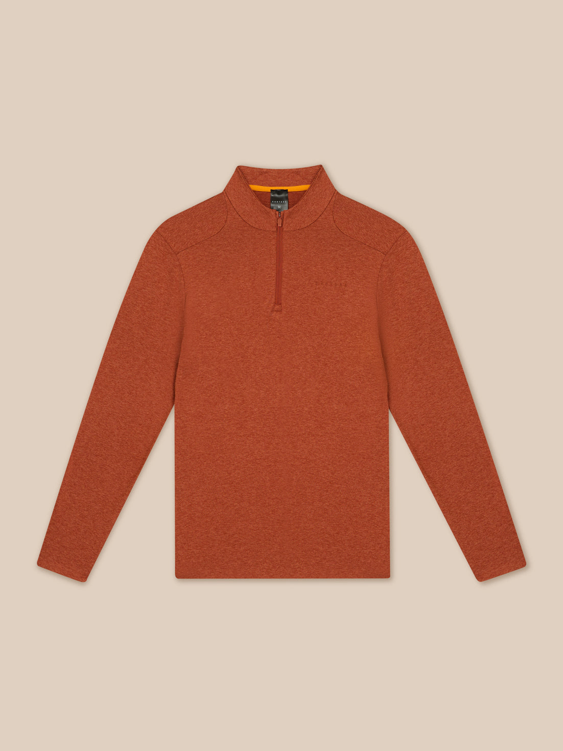 Flat lay shows the dark rust Elevated Lifestyle quarter zip top with a center front zipper on a beige background