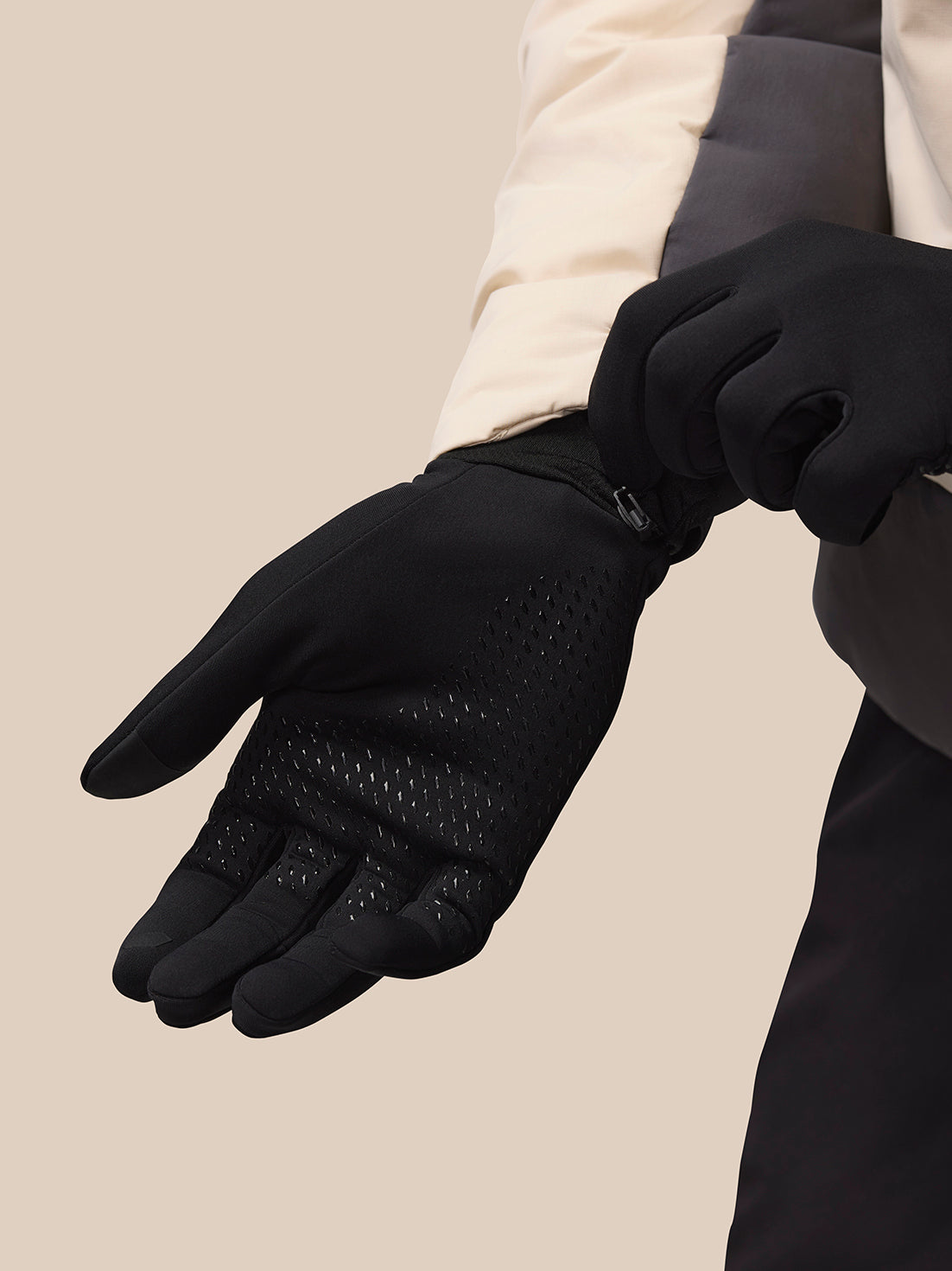 Close-up of black Pursuit glove displaying dotted silicone grip along the palm and snug cuff