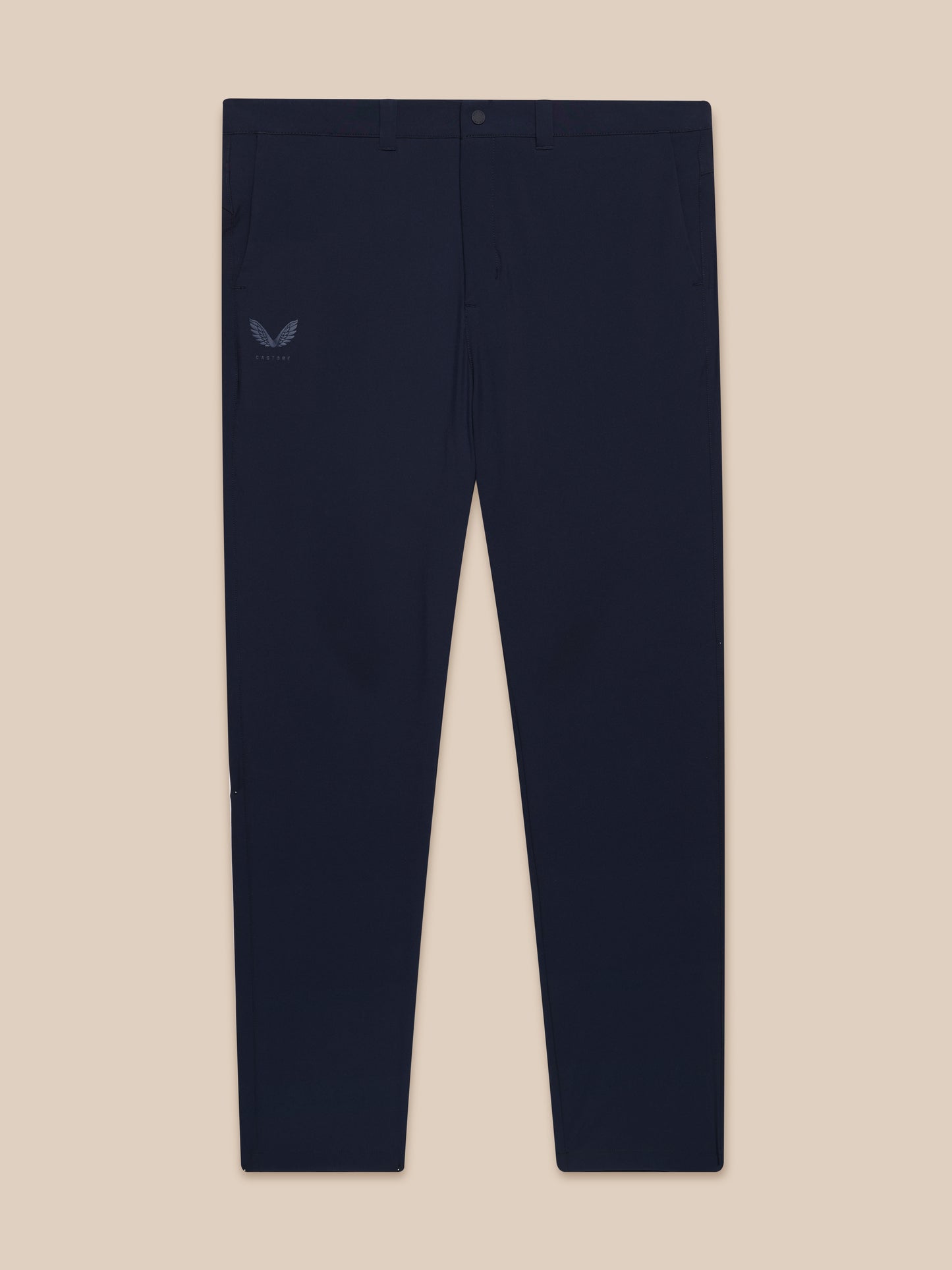 Full-body shot of male model wearing navy Golf Lightweight Club Trousers with matching top and white sneakers.