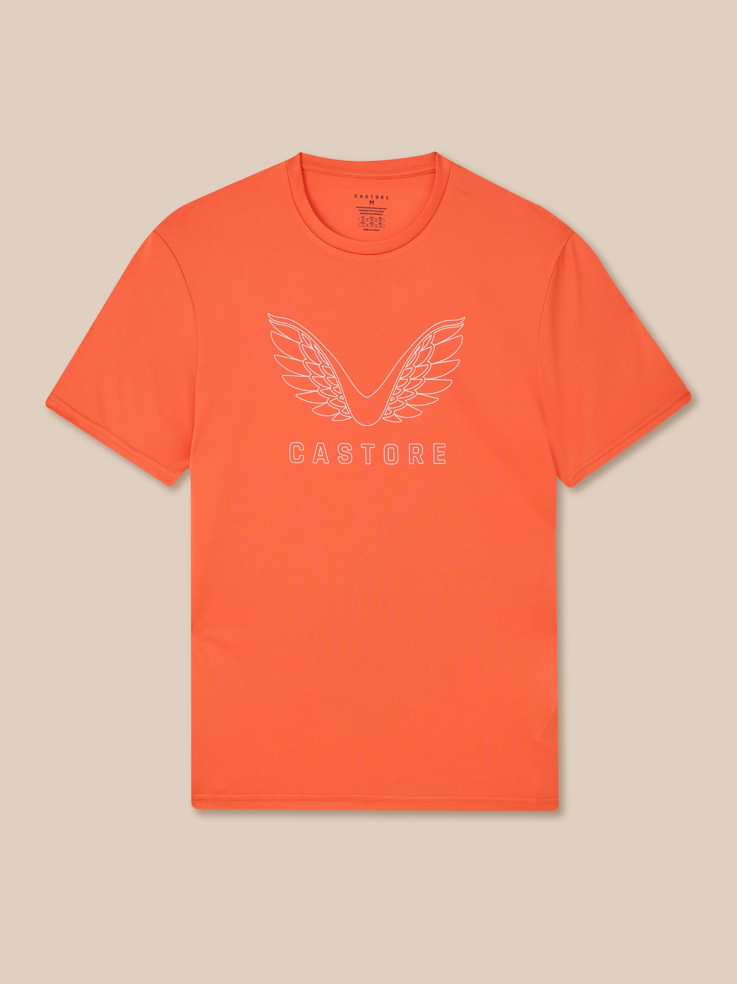 Bright orange Castore graphic training T-shirt featuring a white wing logo across the chest