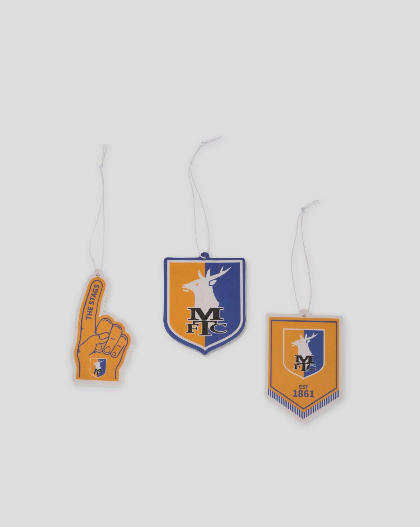 Three MTFC themed air fresheners on cords featuring a foam finger tag a shield crest and a rectangular emblem