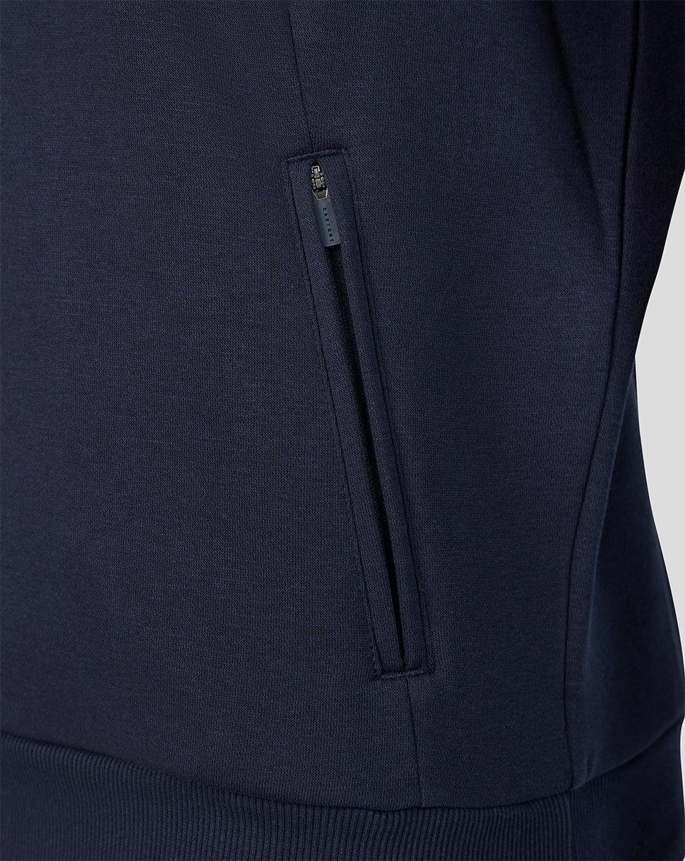 Close-up of navy Harlequins Travel Sweatshirt with zippered side pocket.