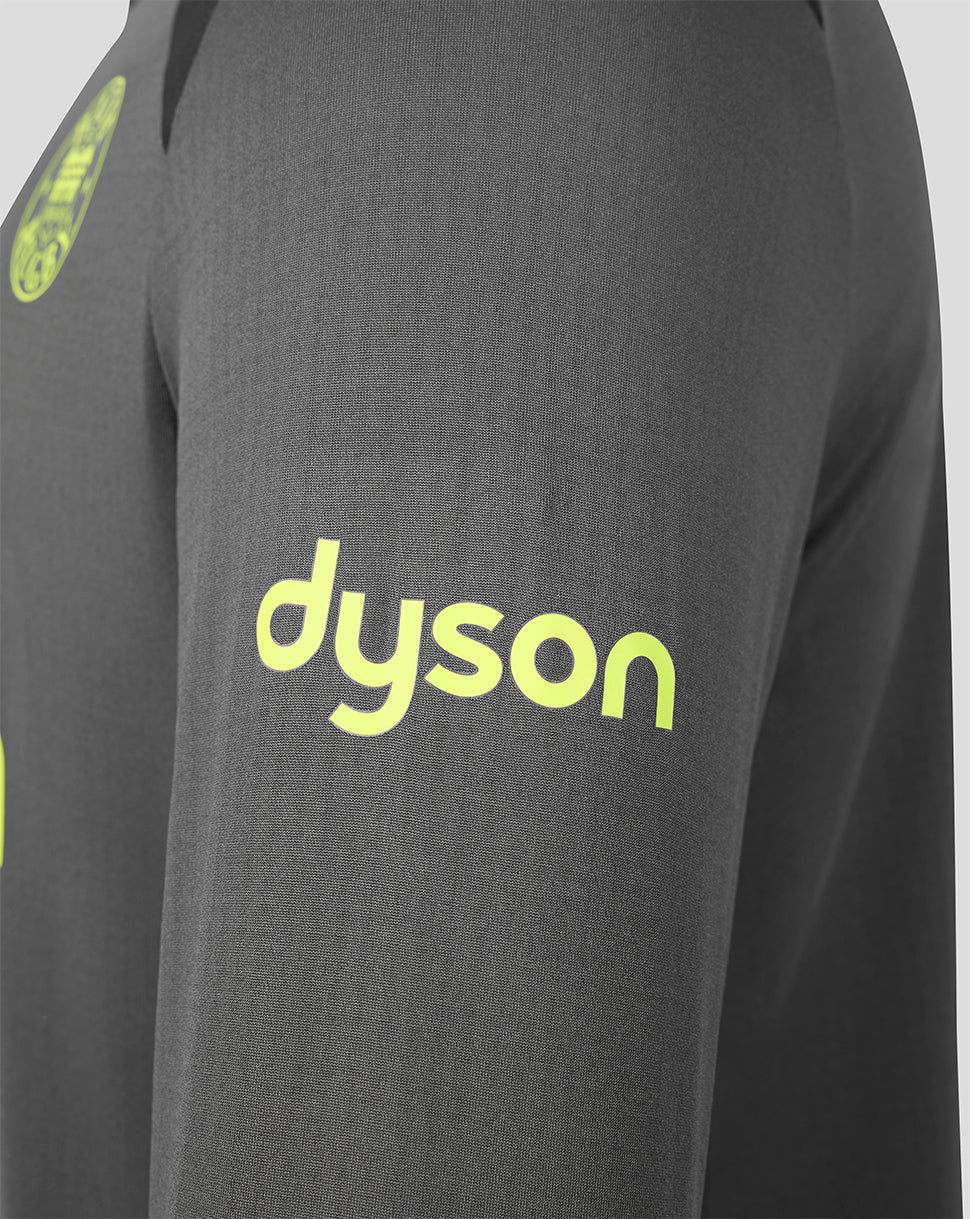Close-up of a dark gray athletic top with a bright neon yellow-green Dyson logo printed on the chest.