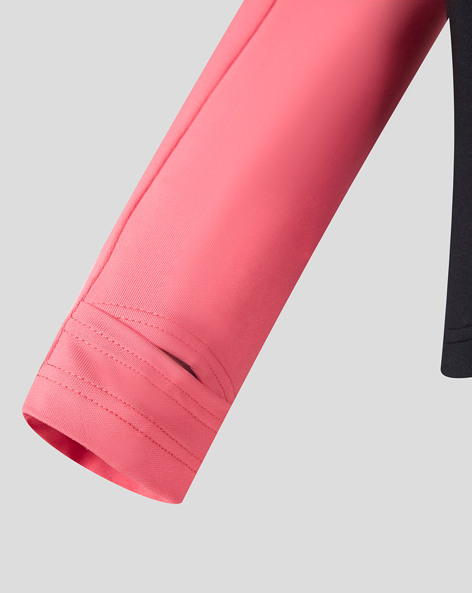 Close up of coral pink sleeve from Rangers women's training quarter zip showing cuff stitching