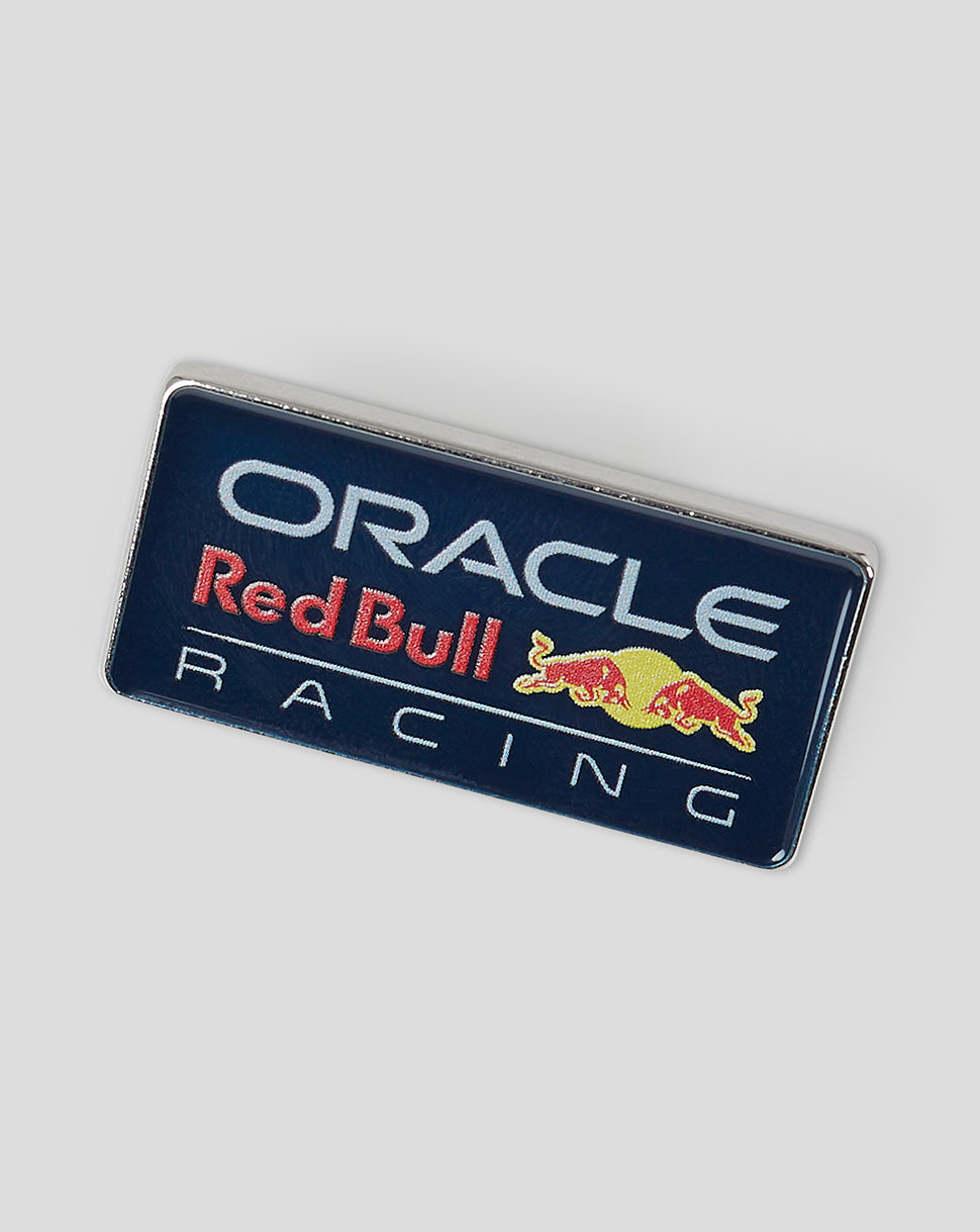 Oracle Red Bull Racing pin badge with logo and bull mascots on a navy background.