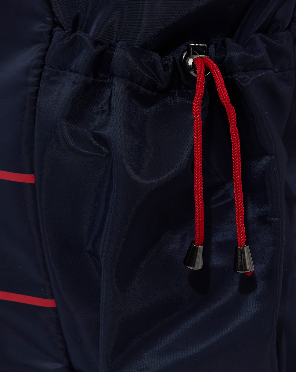 Navy blue Red Bull Racing backpack with red drawstrings and black cord tips.
