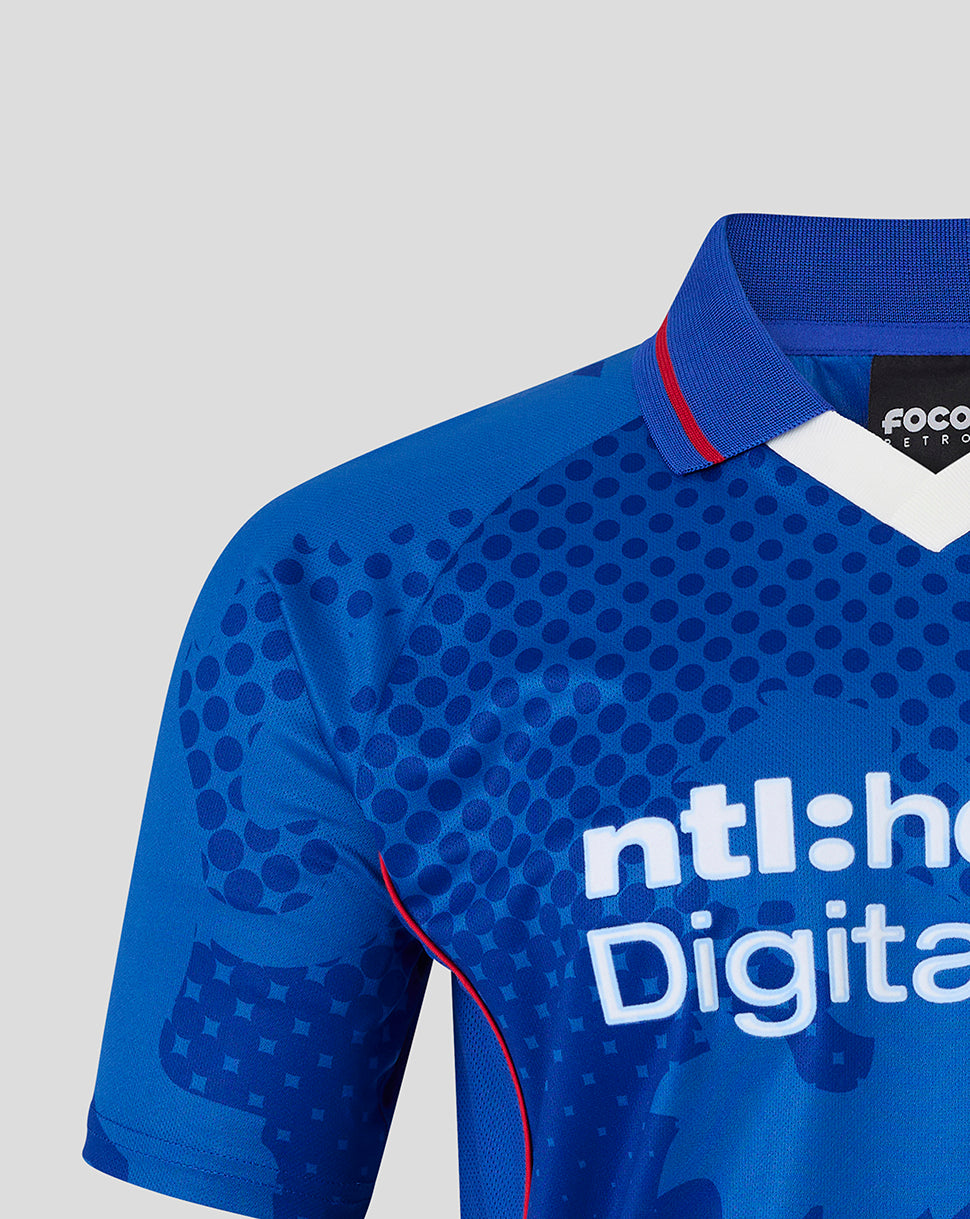 Shoulder and chest of the blue Rangers jersey with dotted print and large abstract shapes and a blue collar.