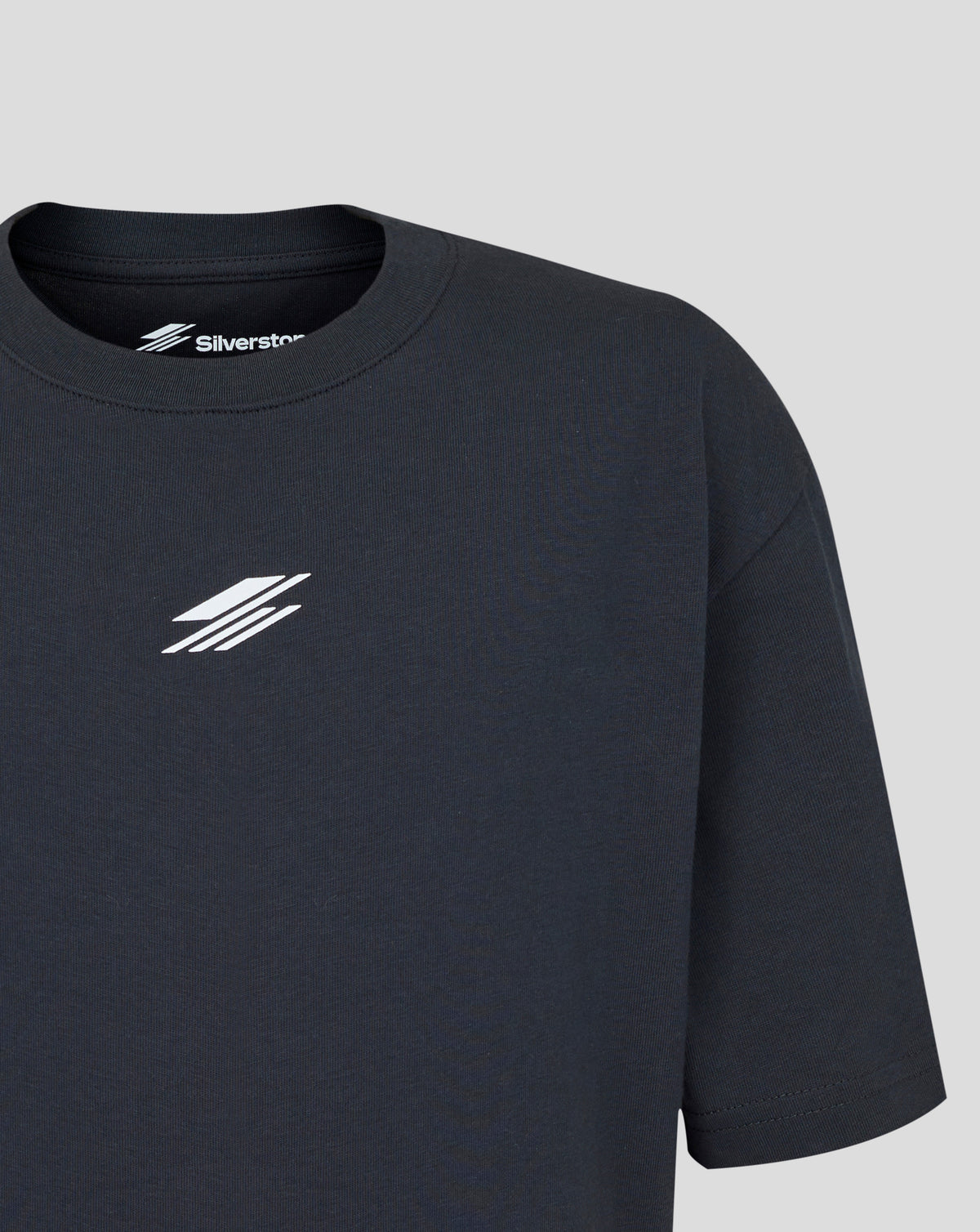 Black t-shirt with a logo on a gray background