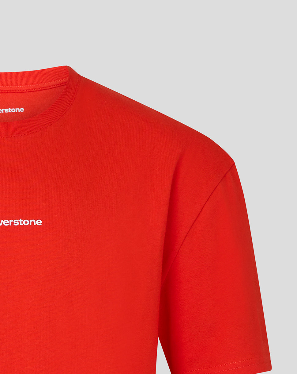 Close-up of a bright red short-sleeve t-shirt showing the left chest area with a small white 'silverstone' logo, on a light gray background.