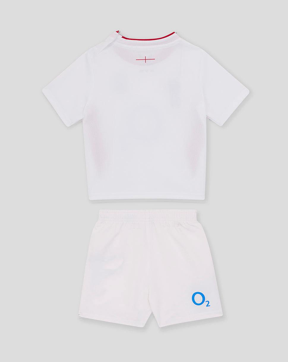 Back view of baby England Rugby home kit white top with red neck trim and matching shorts featuring the O2 logo