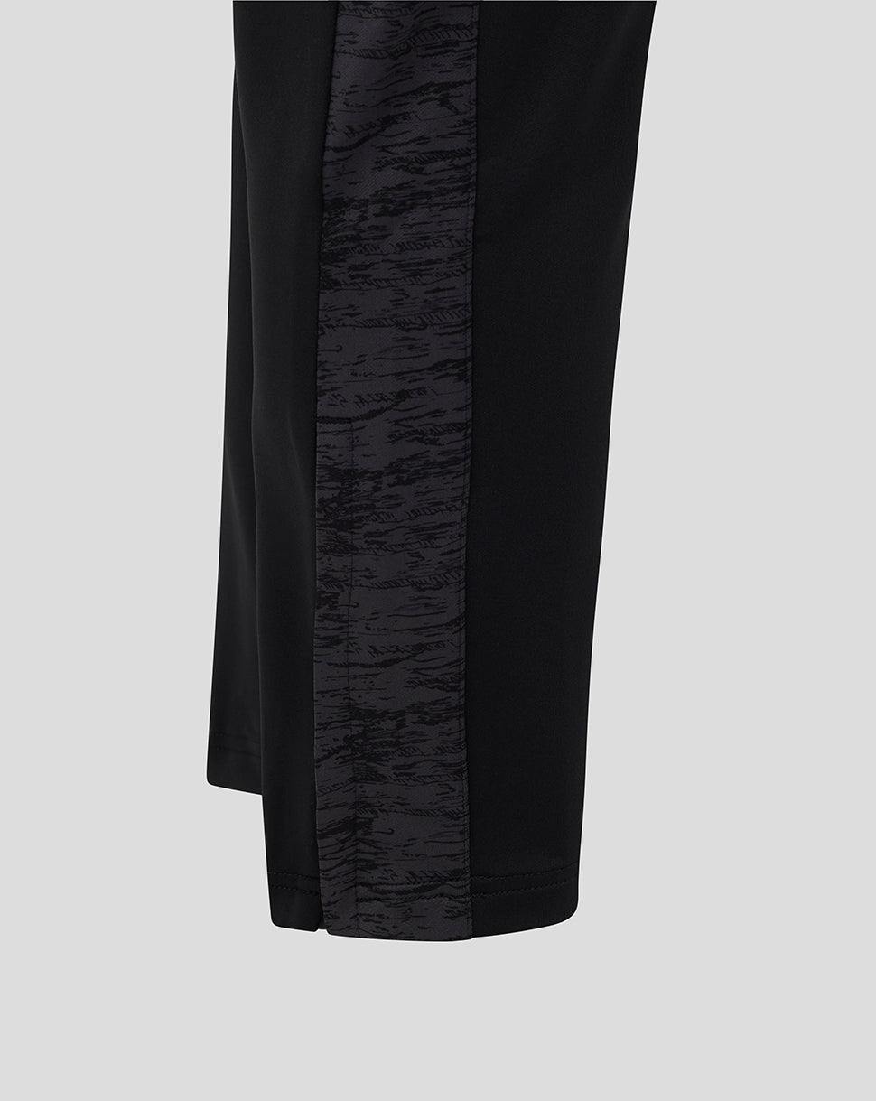 Close up of black Bath Rugby pants showing a textured side panel down the leg.