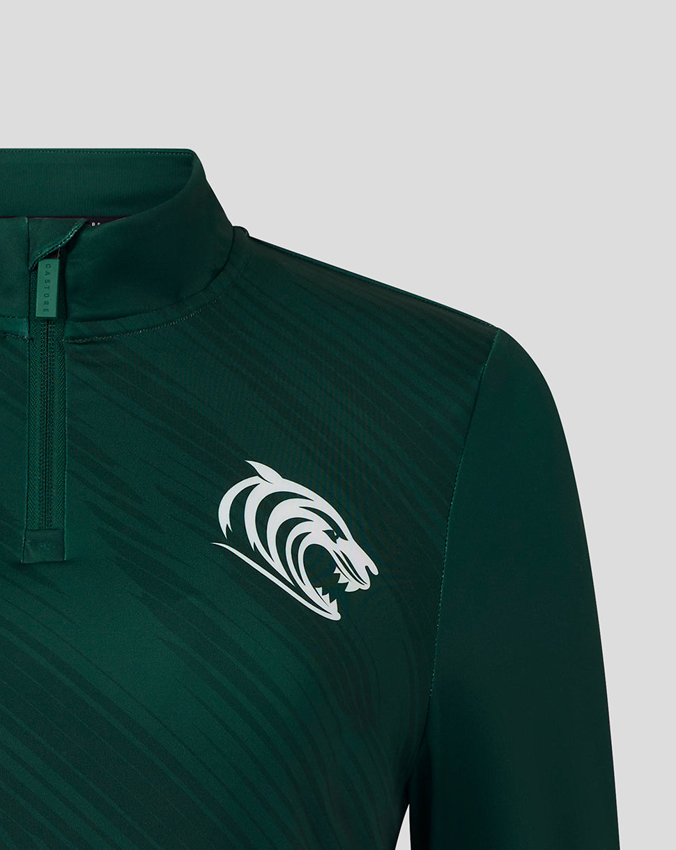 Close-up of dark green training quarter zip with white tiger crest on the chest