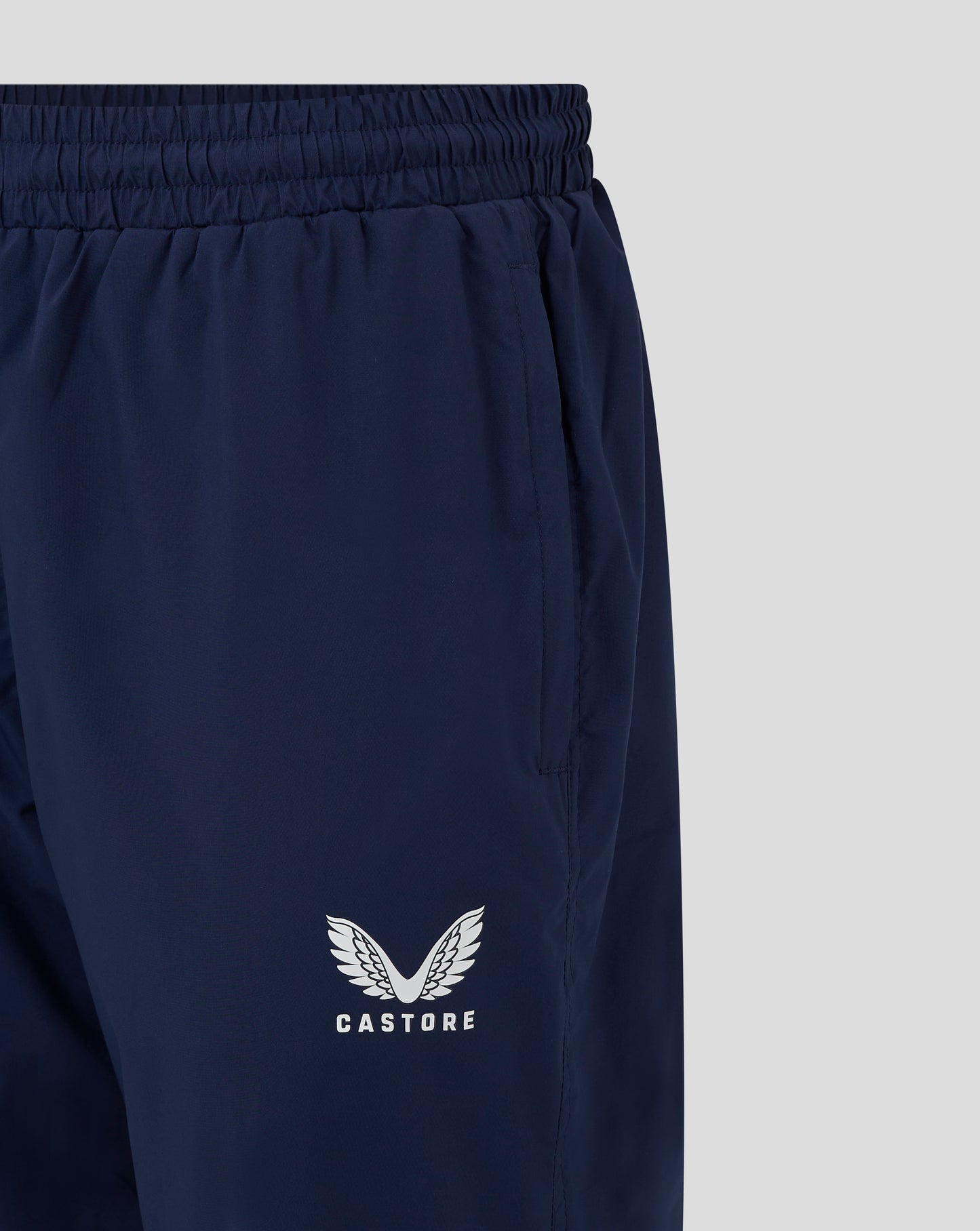 Castore logo with wings on navy rugby pant leg