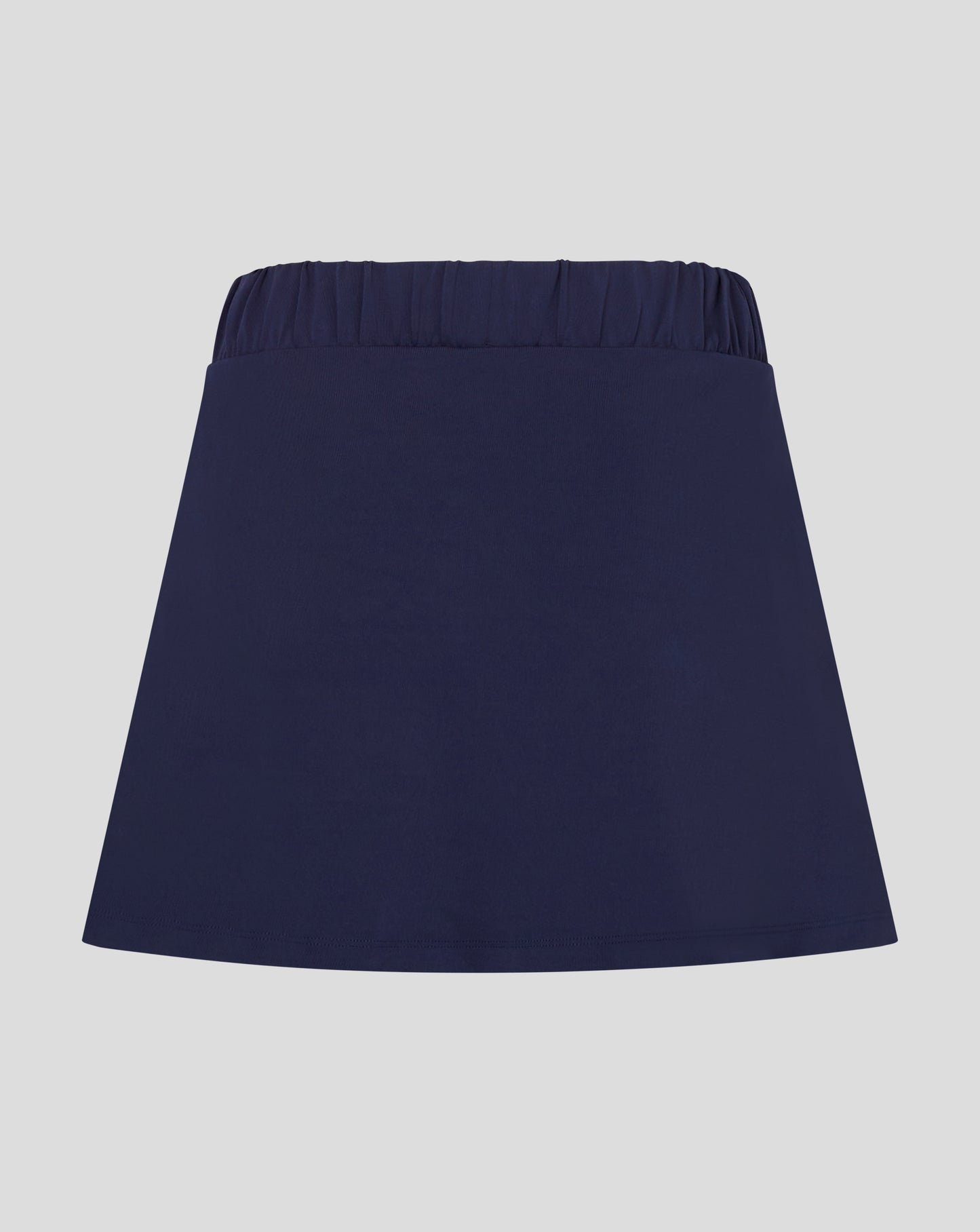 Rear view of navy Castore skort with elasticated waistband