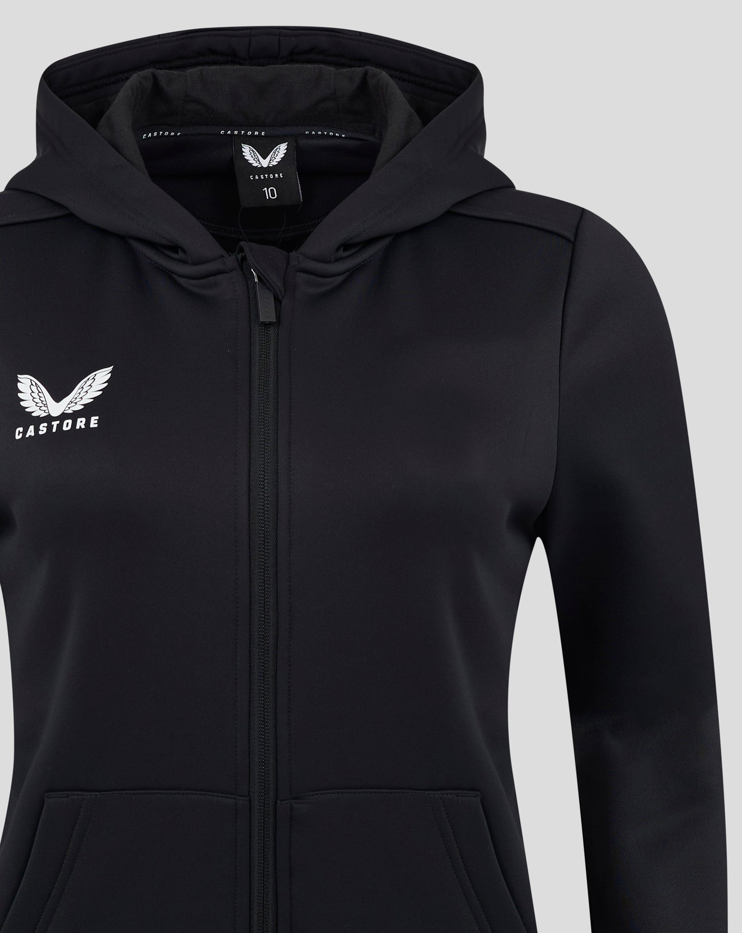 Close up of black Castore hoodie showing the chest logo and interior hood label.
