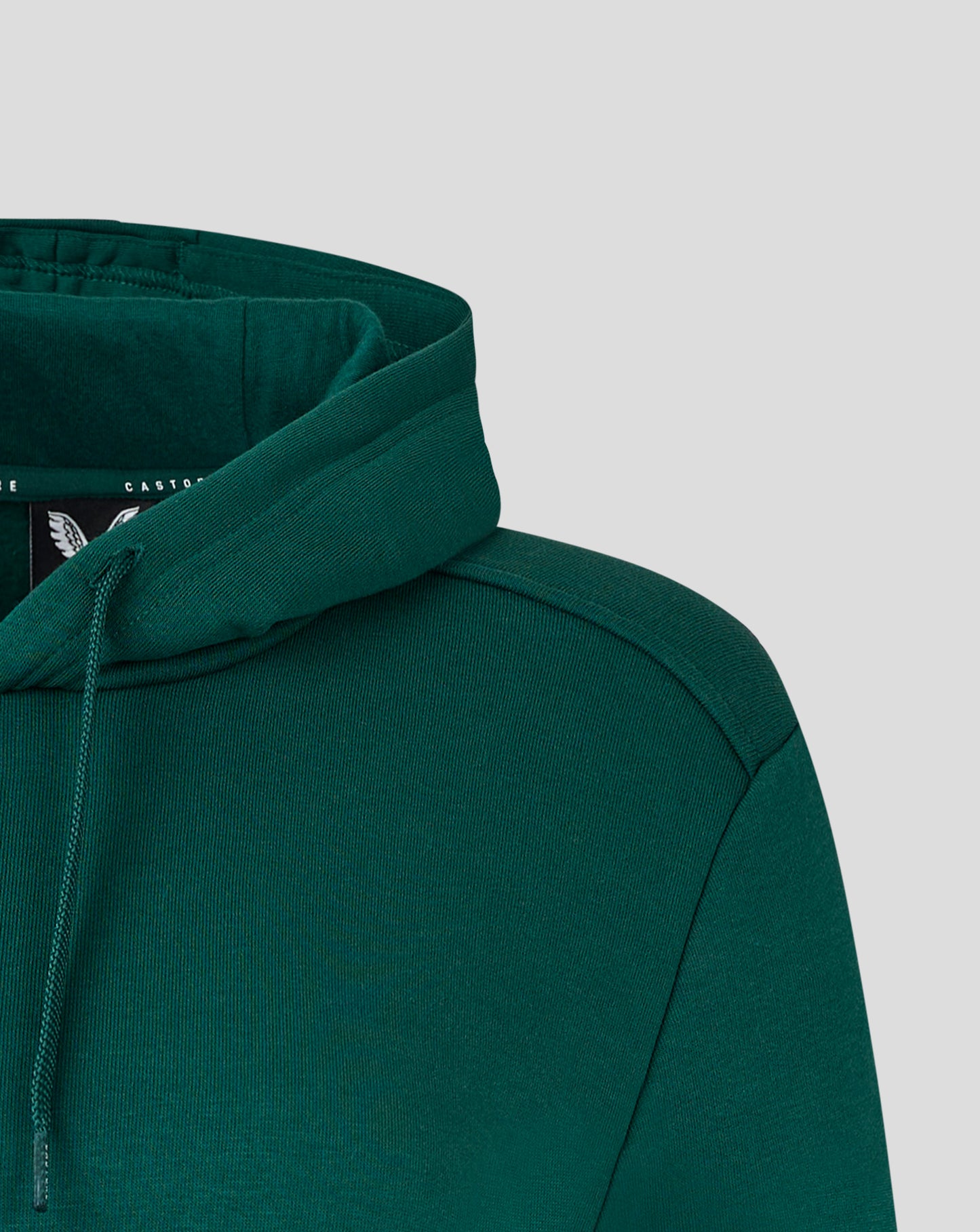 Close up of the green hood on a Castore Hoodie with jersey lining and heat sealed logo edge