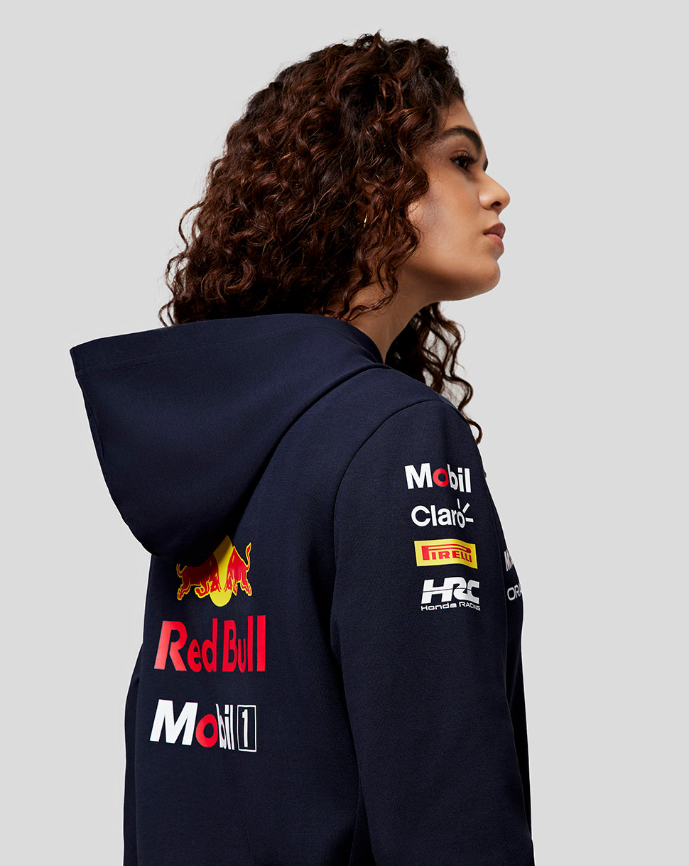 Rear view of navy Teamline hoodie showing large back graphic and sponsor branding on chest and sleeve