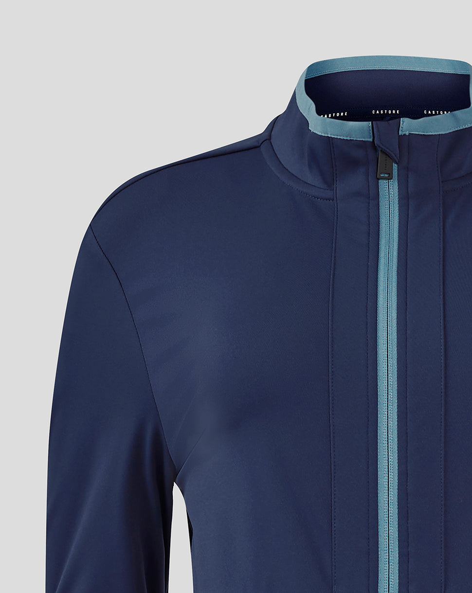 Close up of navy Rangers Women travel softshell jacket neck area with light blue zip and panel details