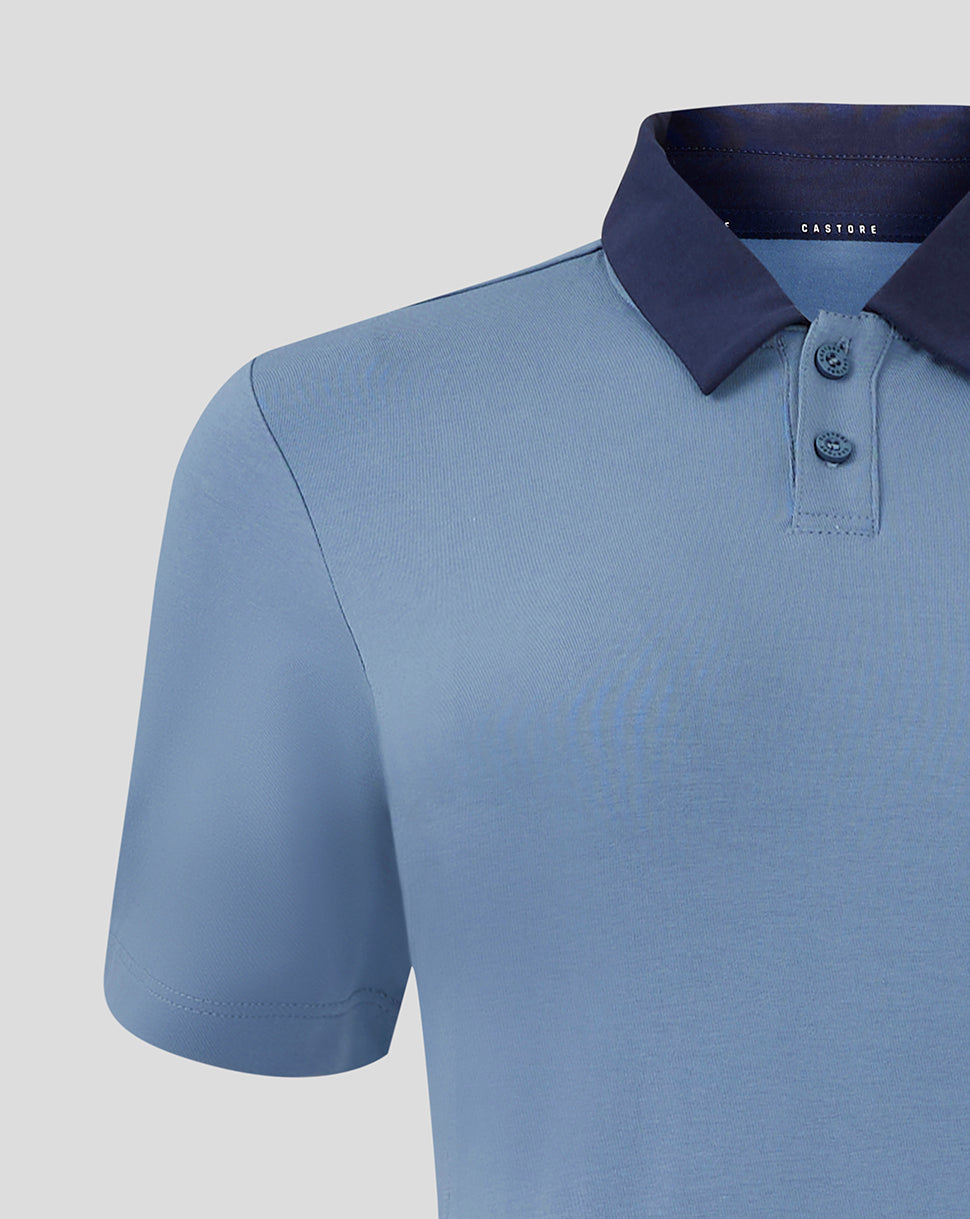 Close-up of navy collar and two-button placket on light blue Rangers polo with Castore branding inside