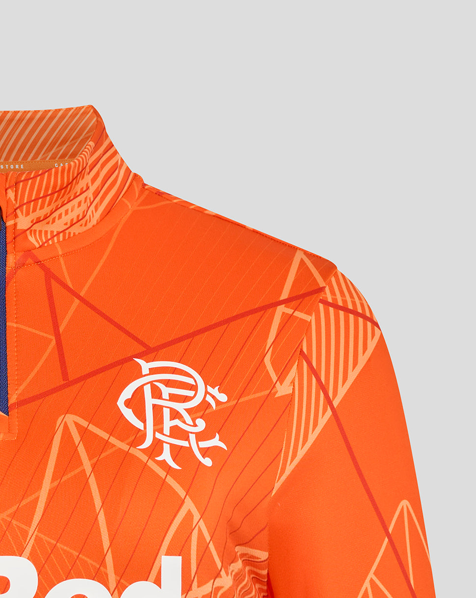 Close-up of the shoulder and sleeve on the orange geometric Rangers midlayer highlighting the pattern and construction.