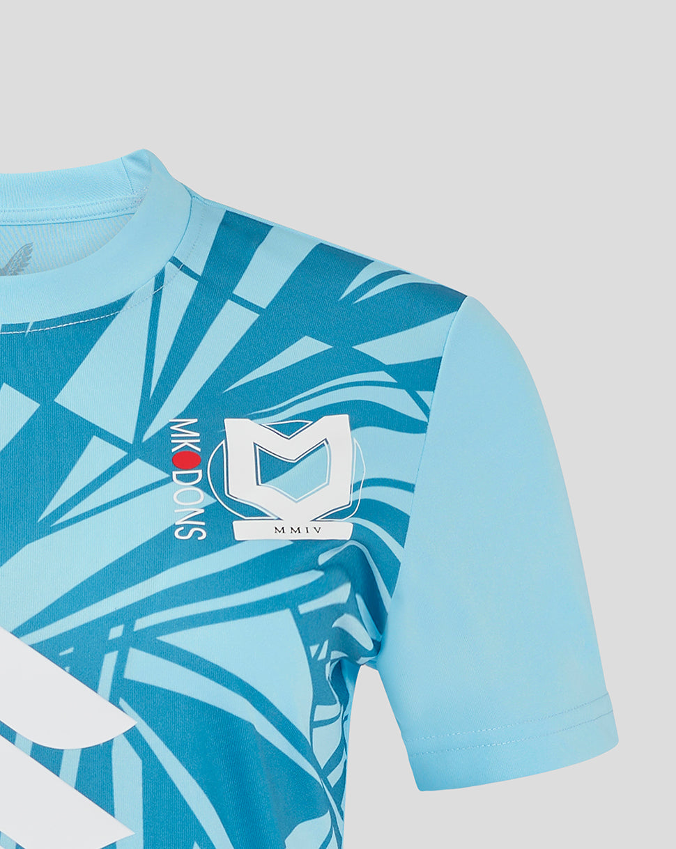 Front close up of turquoise Mk Dons Women's 24/25 third goalkeeper shirt with club crest and bold geometric print.
