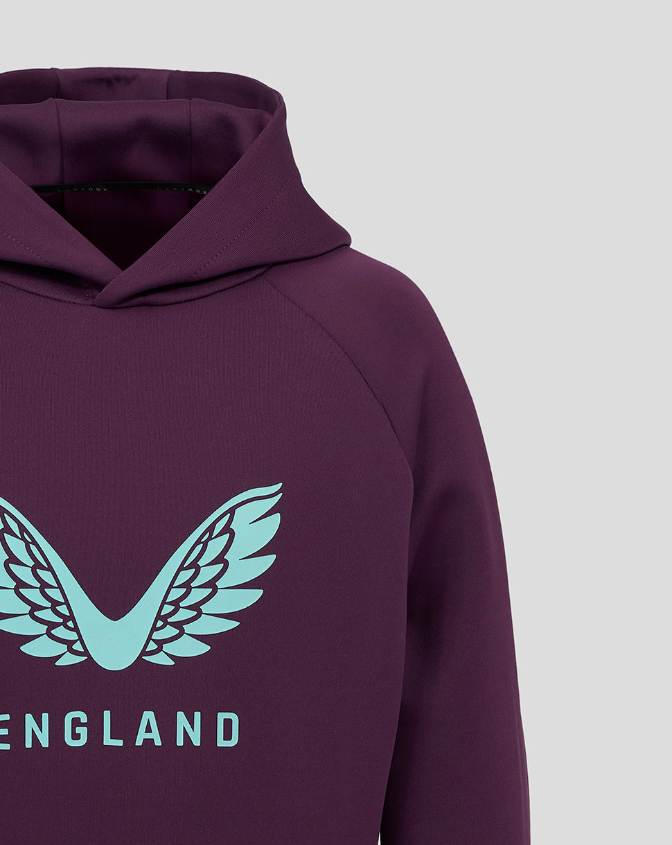 Close up of purple hoodie chest with teal wings logo and ENGLAND text