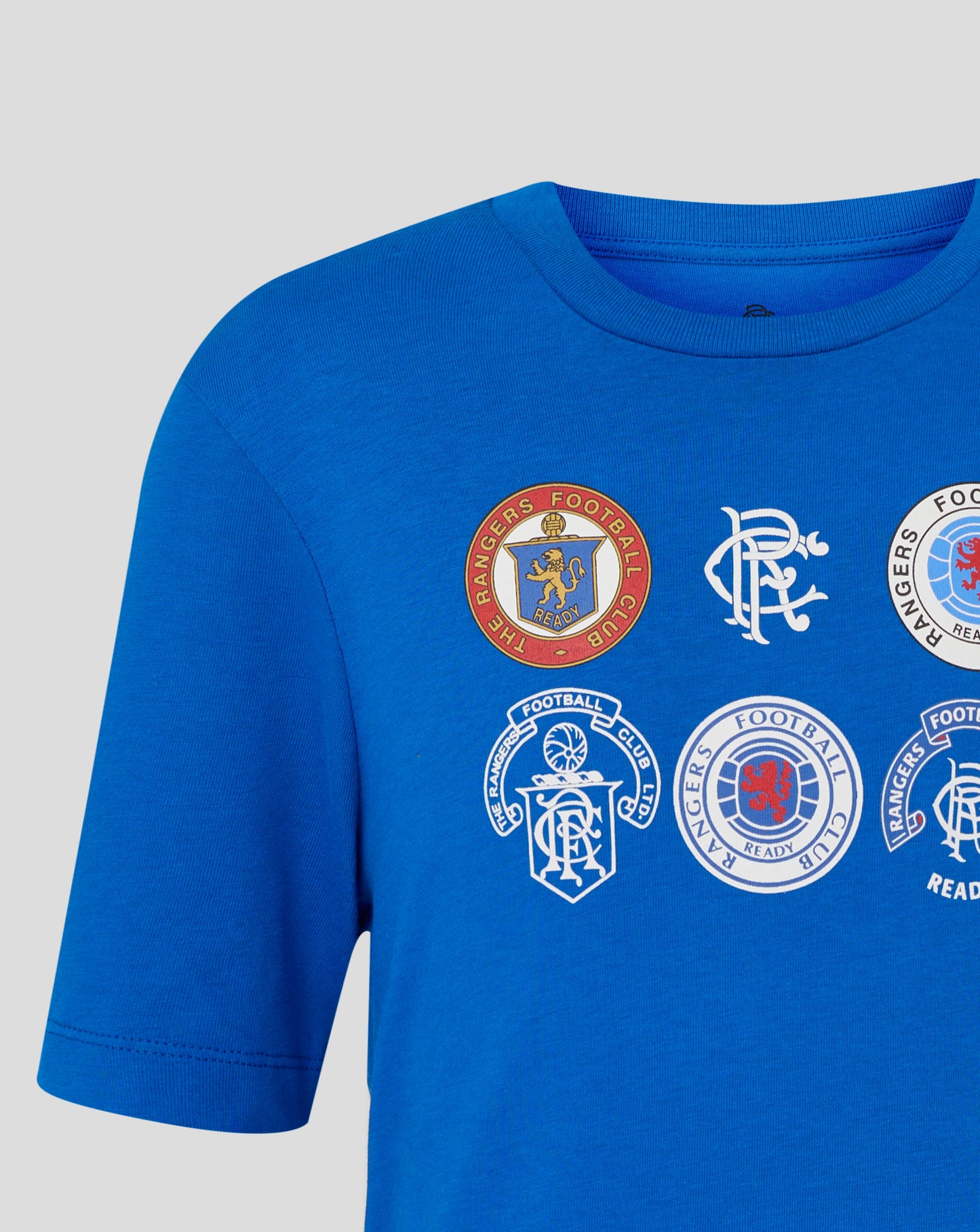 Rangers Junior 25/26 Badge Tee in lapis blue with round club badges printed on the chest