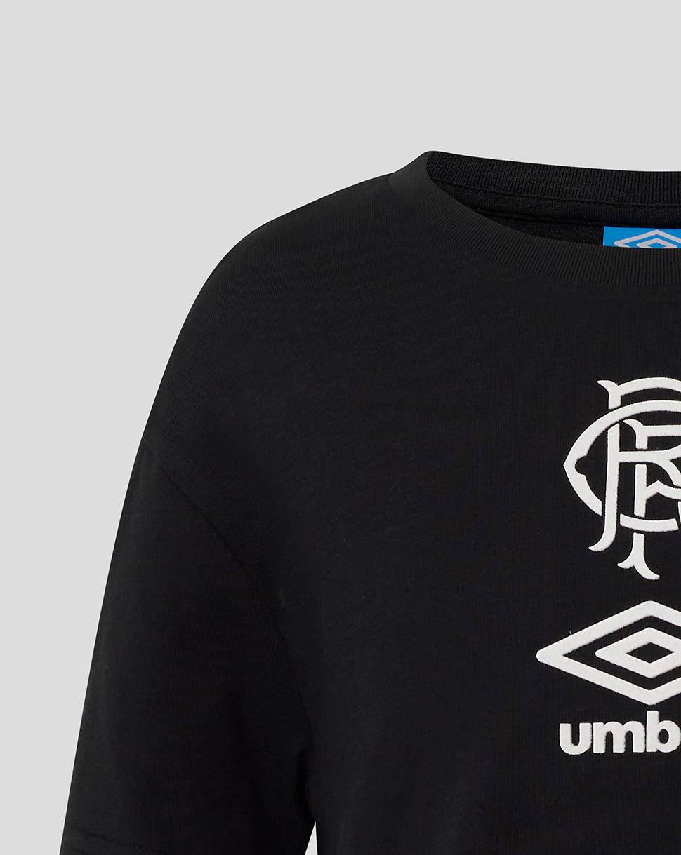 Close-up of Rangers Junior travel short sleeve tee in black showing white crest and Umbro logo