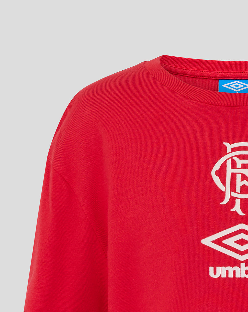 Neckline close-up of the red Rangers Junior travel short sleeve tee with a blue Umbro tag at the collar.