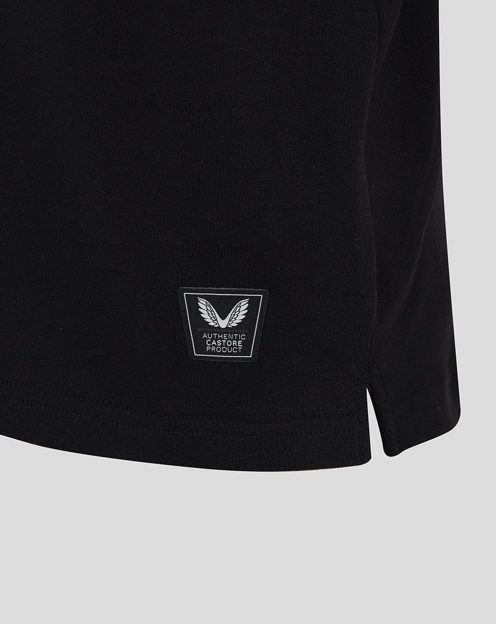 Close-up of black England Rugby junior shirt hem with Castore authenticity badge