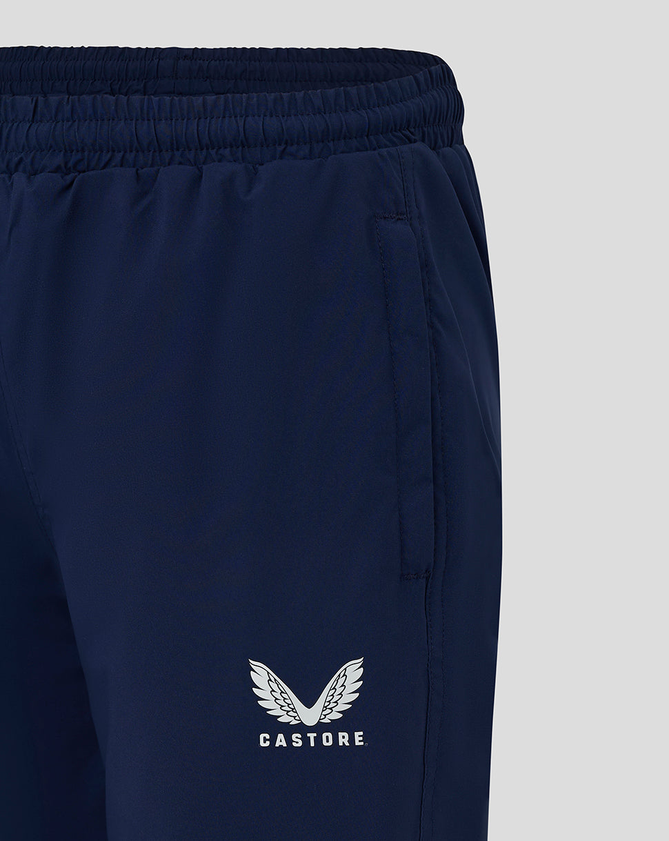 Close up of waistband on peacoat junior pant showing elastic band and Castore logo on the leg