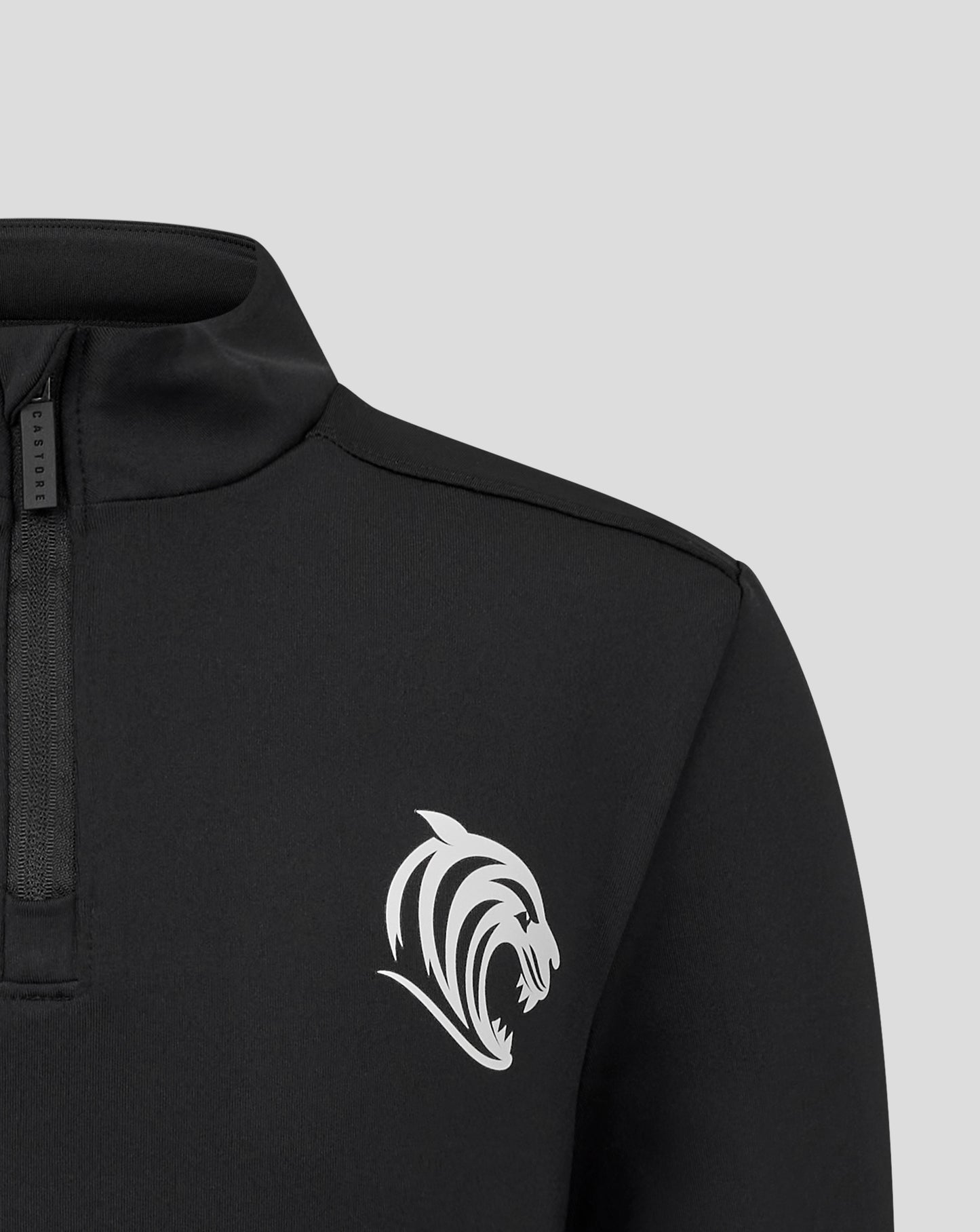Close-up of a black Leicester Tigers junior training midlayer with a high collar and front zipper