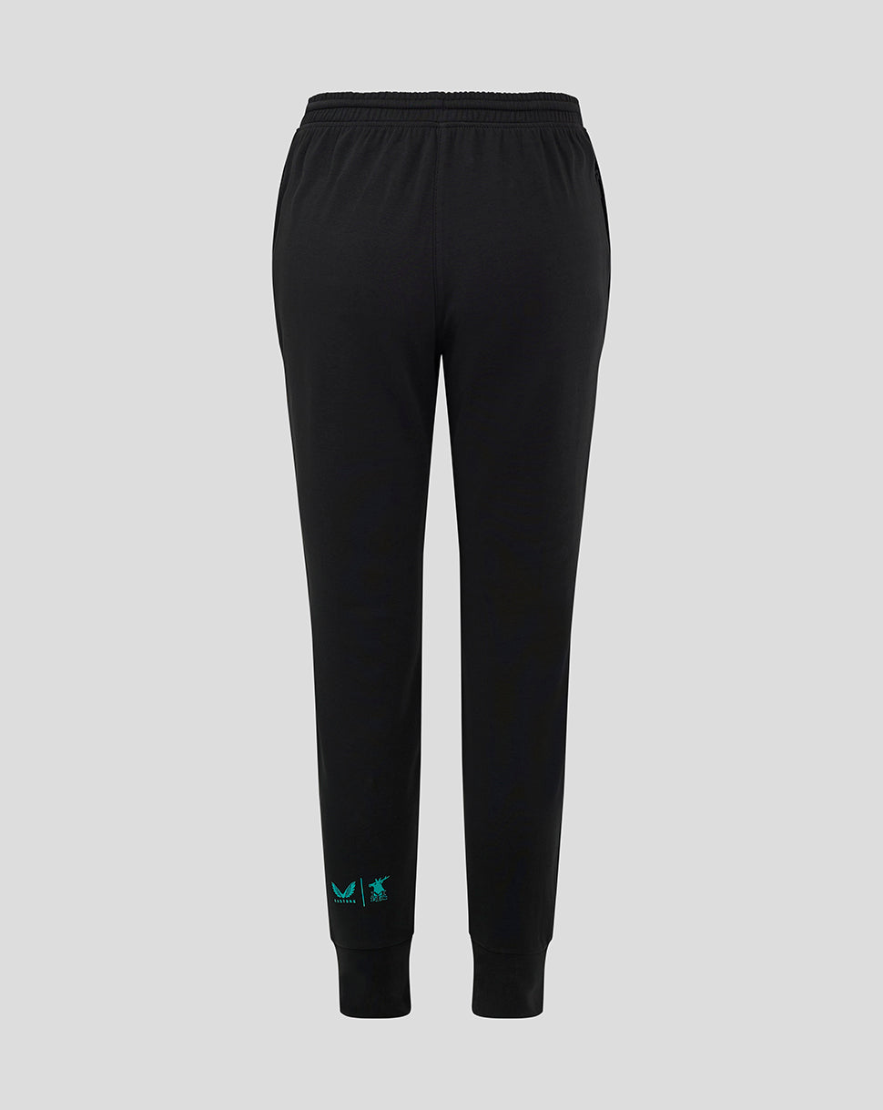 Back view of black Mansfield Town junior travel pants with teal logo at the ankle