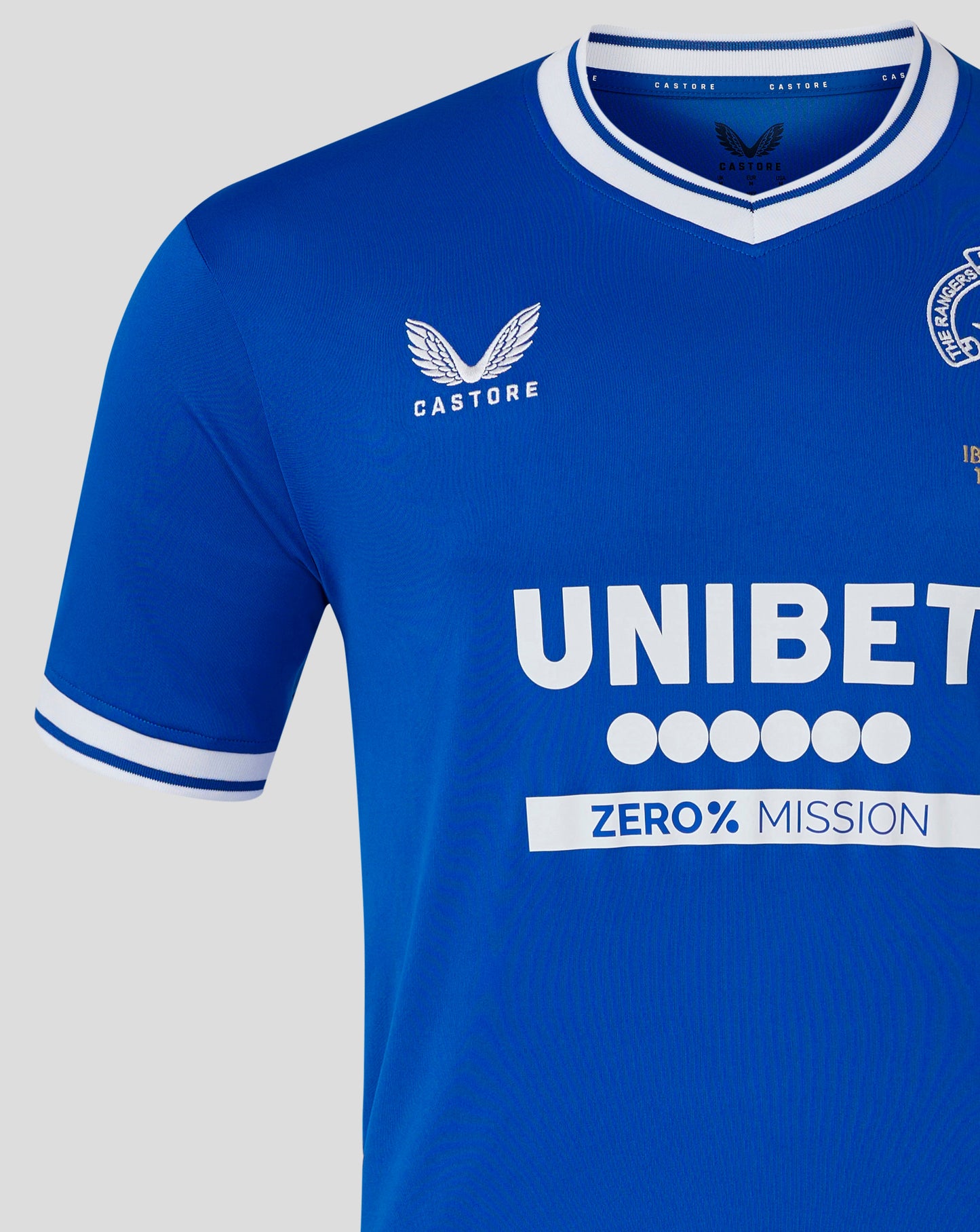 Close-up of blue Rangers Ibrox 125 shirt collar and chest area showing Castore branding and UNIBET lettering.